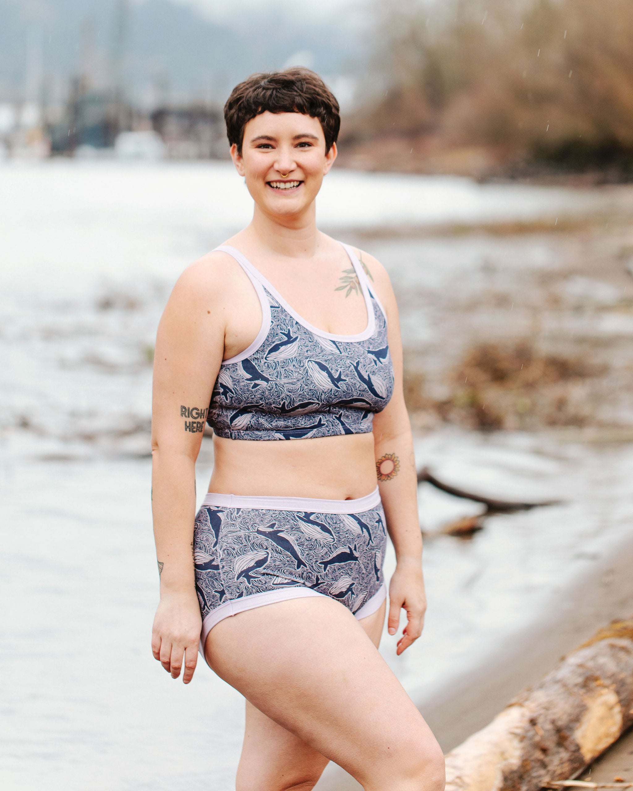 Model wearing Thunderpants Original style underwear and Longline Bra in Whale, Whale, Whale print - indigo whales on lavender.