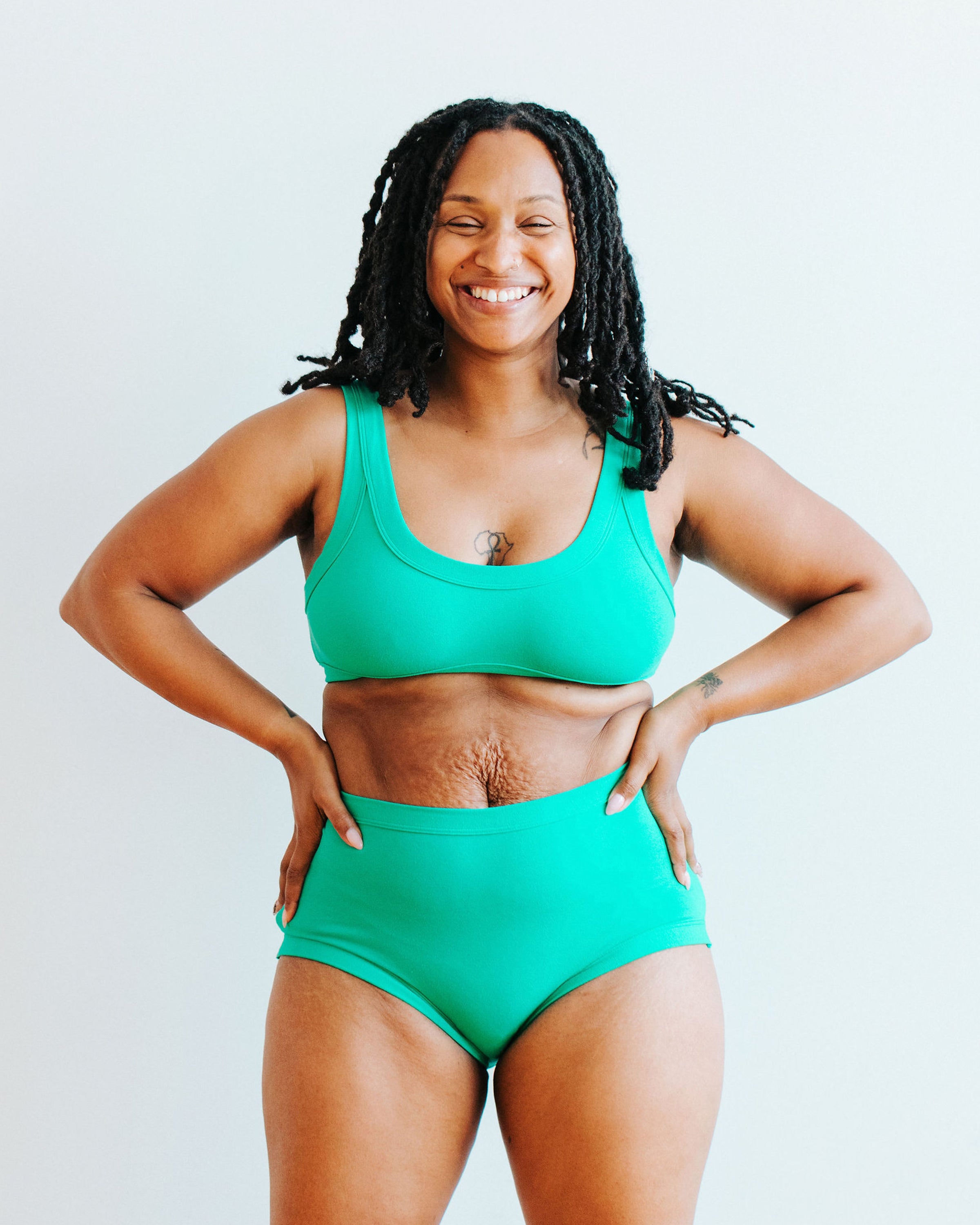 Model wearing Thunderpants Bralette and Sky Rise style underwear in Peacock Green.