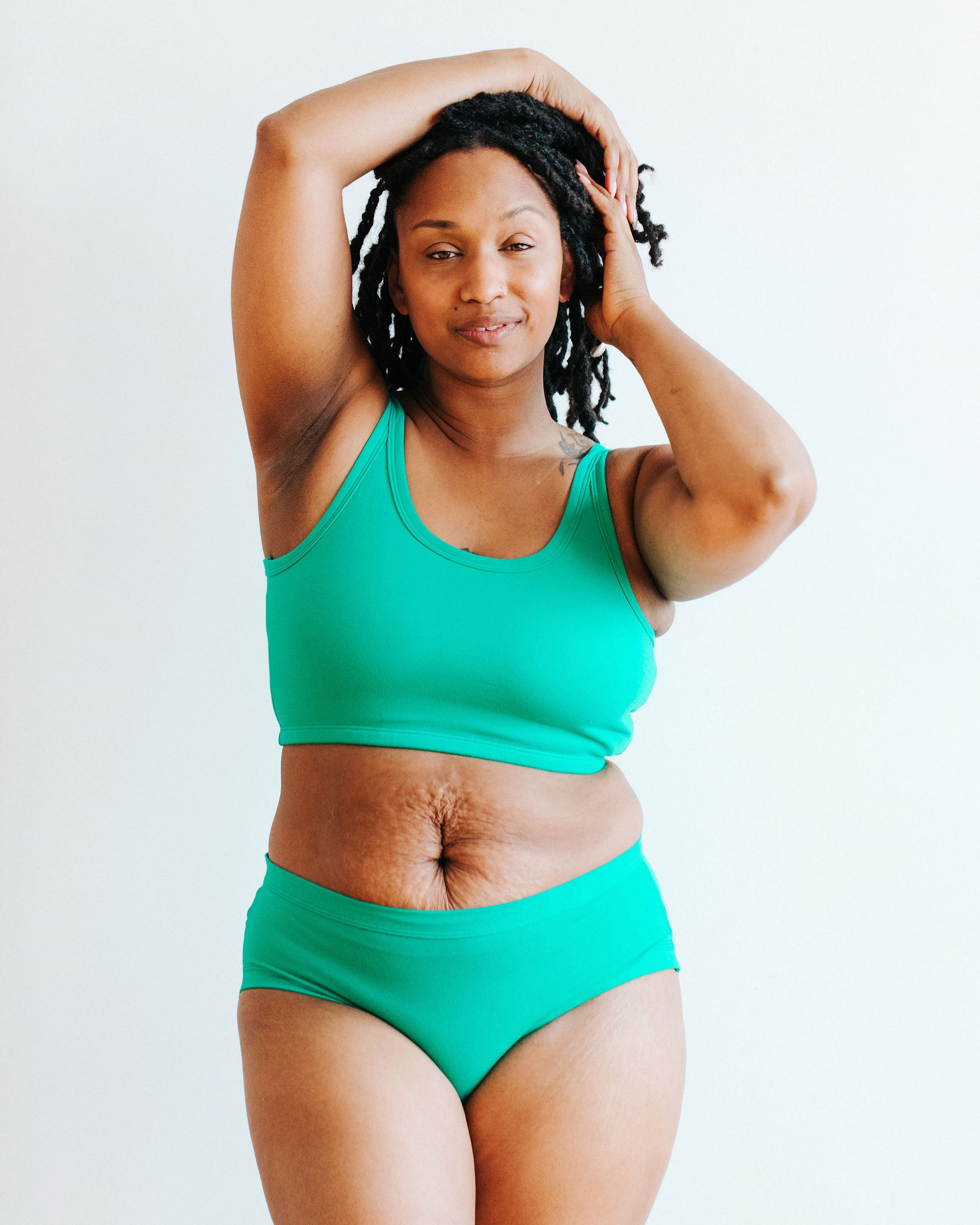 Model wearing Thunderpants Hipster style underwear and Longline Bra in Peacock Green.