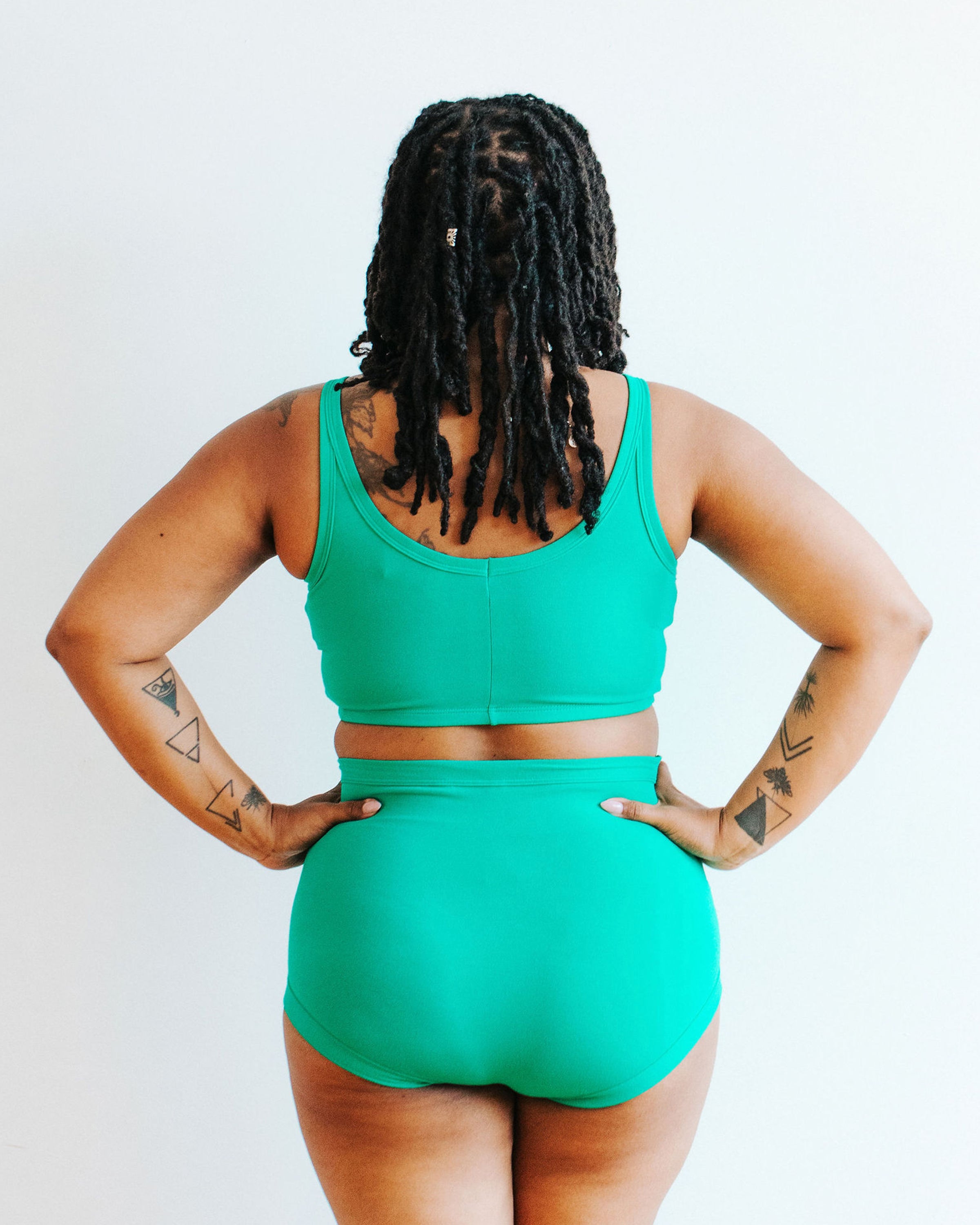 Model wearing Thunderpants Longline Bra and Sky Rise style underwear in Peacock Green.