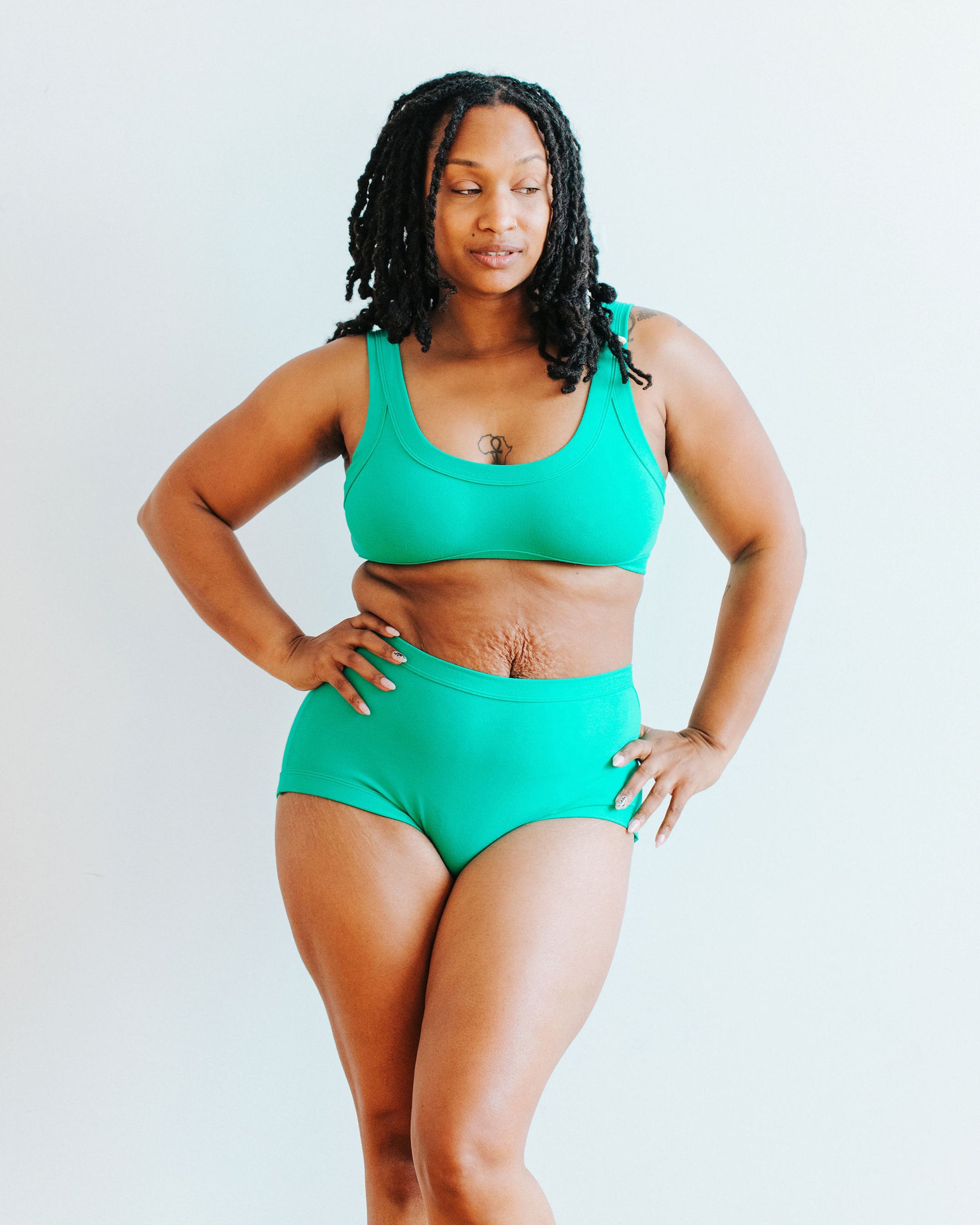 Model wearing Thunderpants Original style underwear and Bralette in Peacock Green.