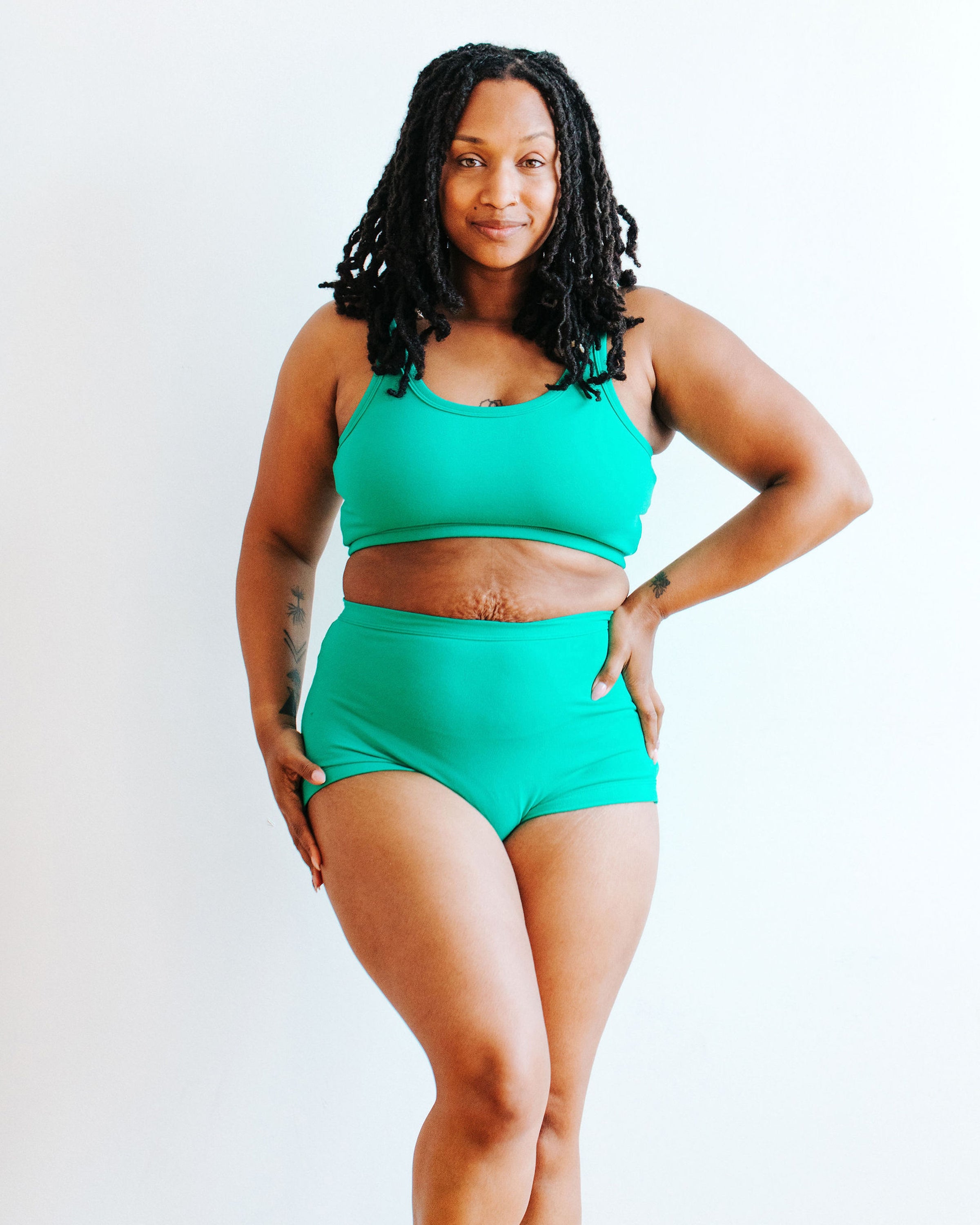 Model wearing Thunderpants Sky Rise style underwear and Longline Bra in Peacock Green.