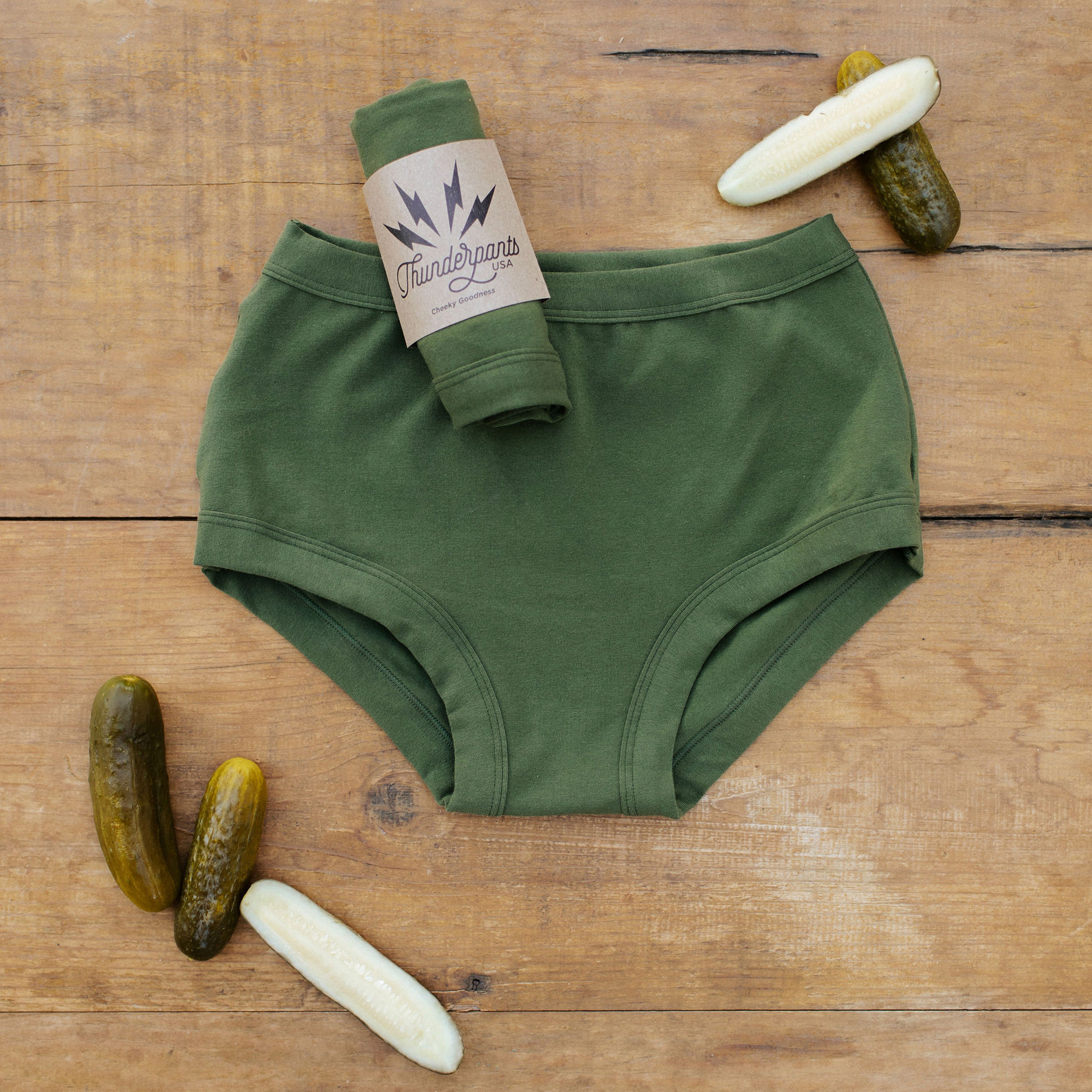 Flat lay of Thunderpants Original style underwear in Pickled Green color with pickles. 