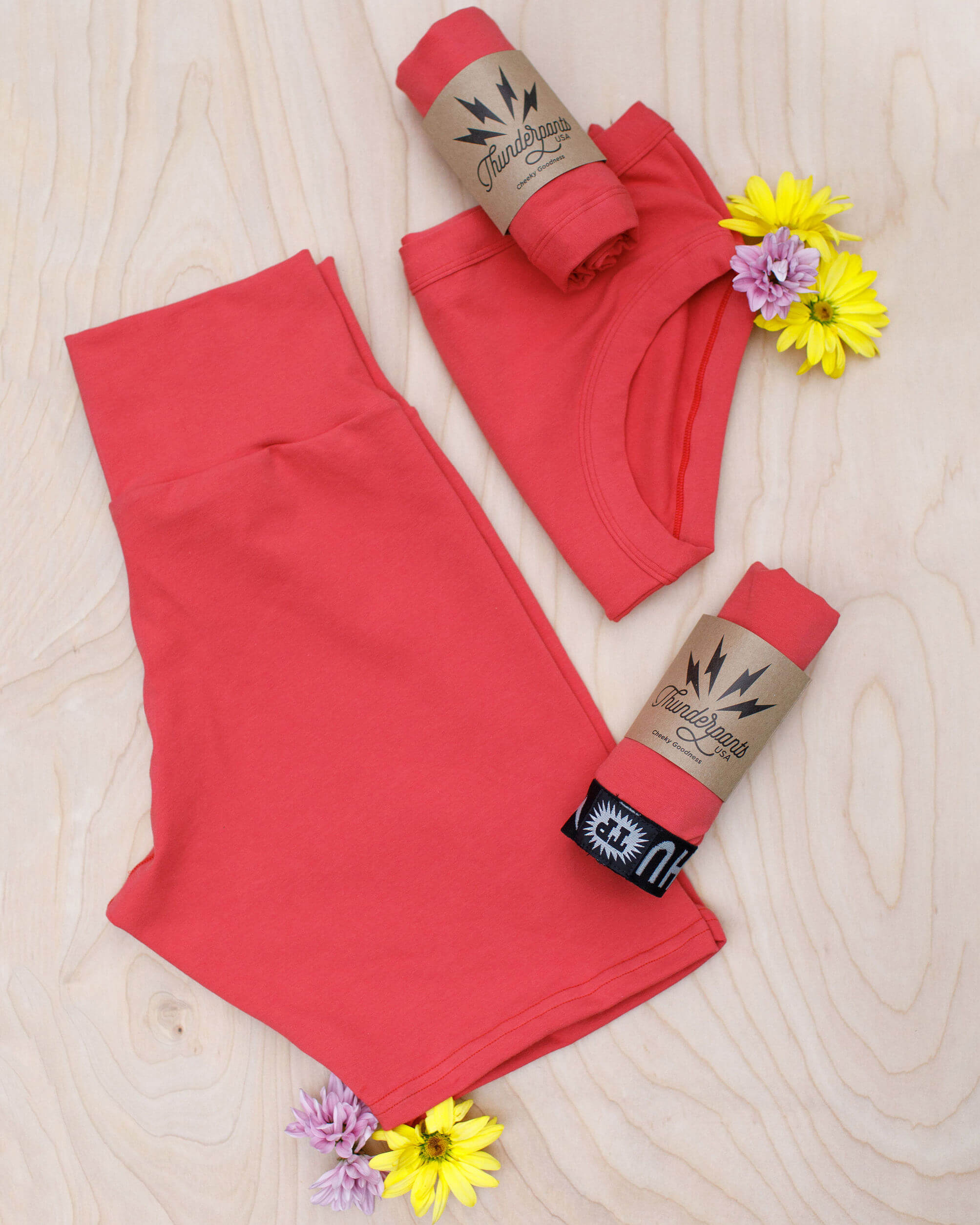 Flat lay of Thunderpants Bike Shorts and Hipster style underwear in Pomegranate Punch color.