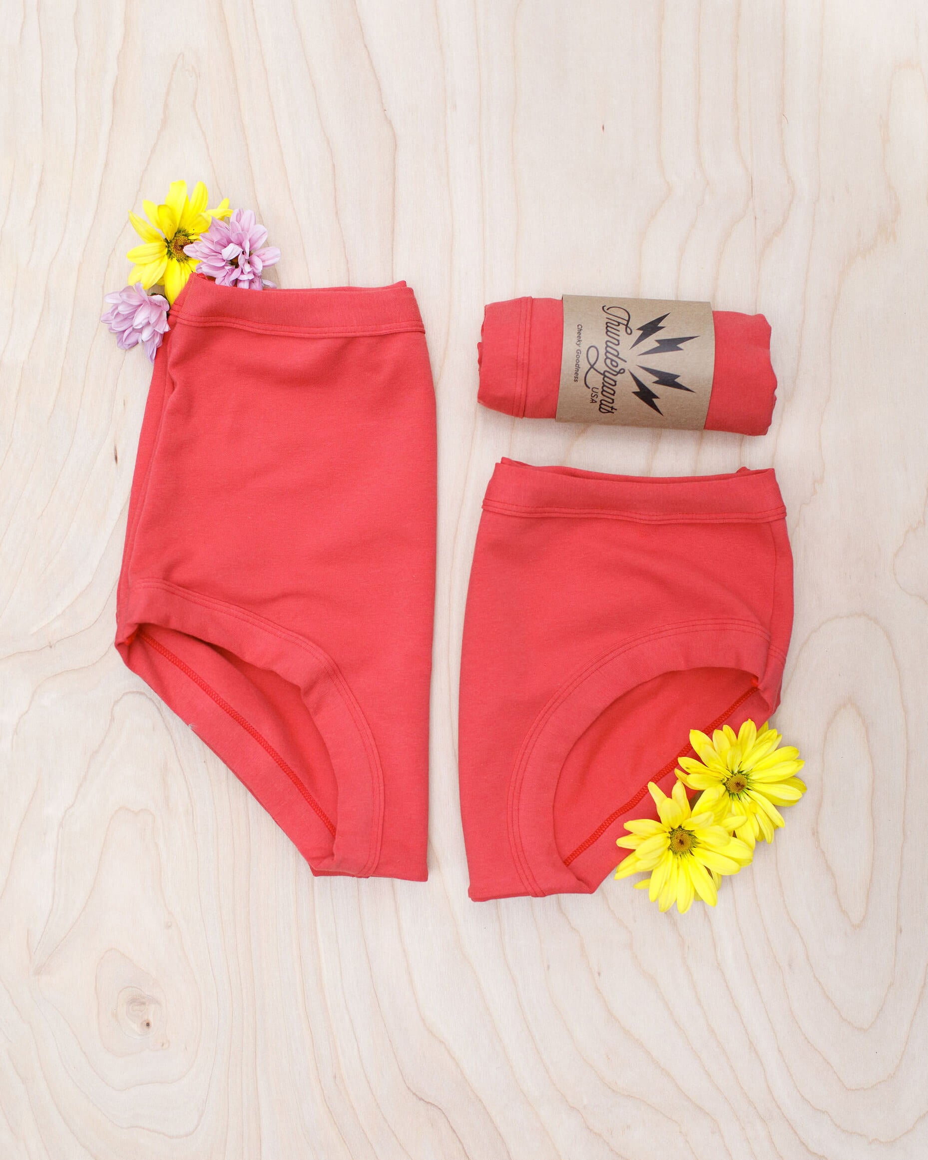 Flat lay of Thunderpants Sky Rise and Hipster style underwear in Pomegranate Punch color.