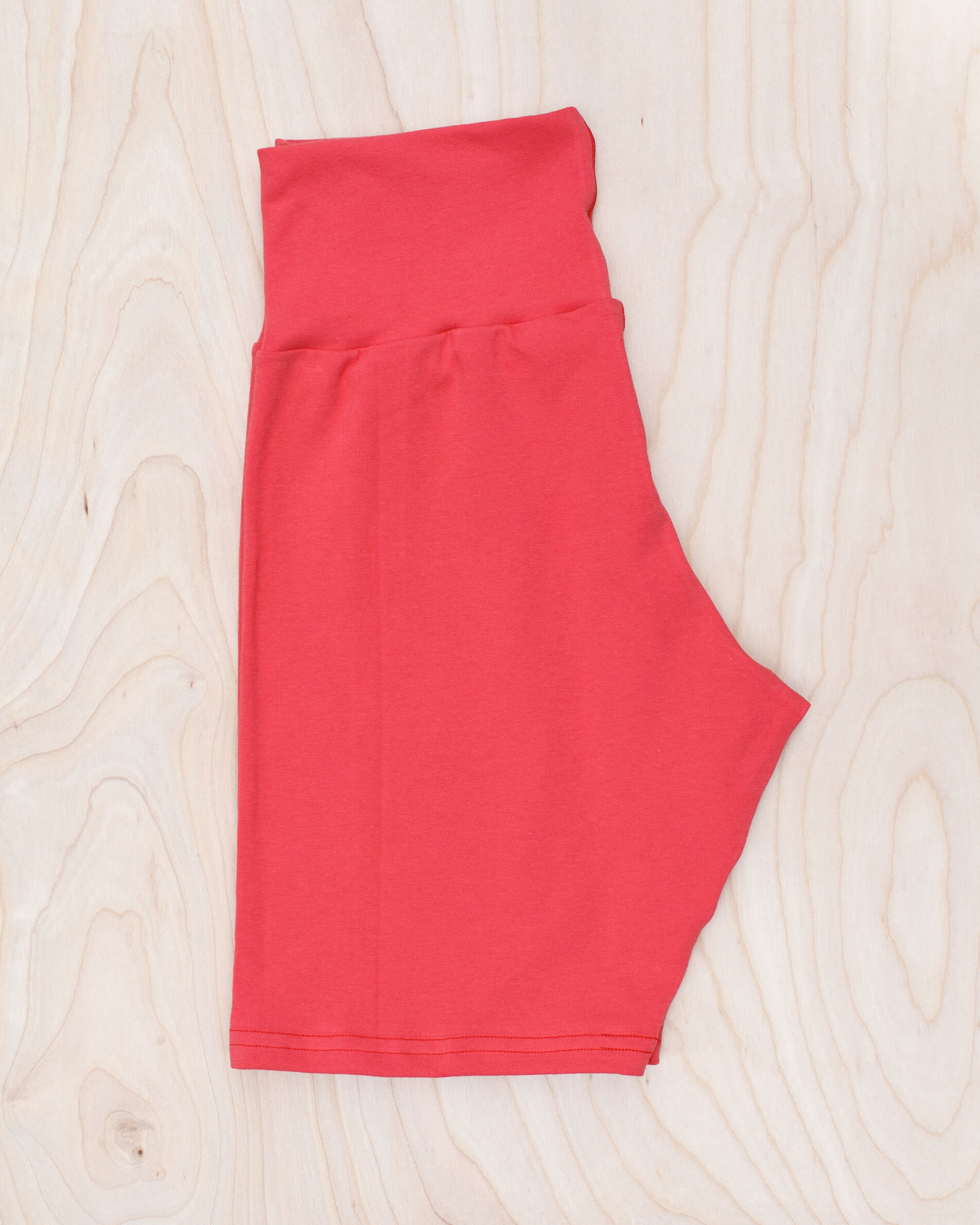 Flat lay of Thunderpants Bike Shorts in Pomegranate Punch color.