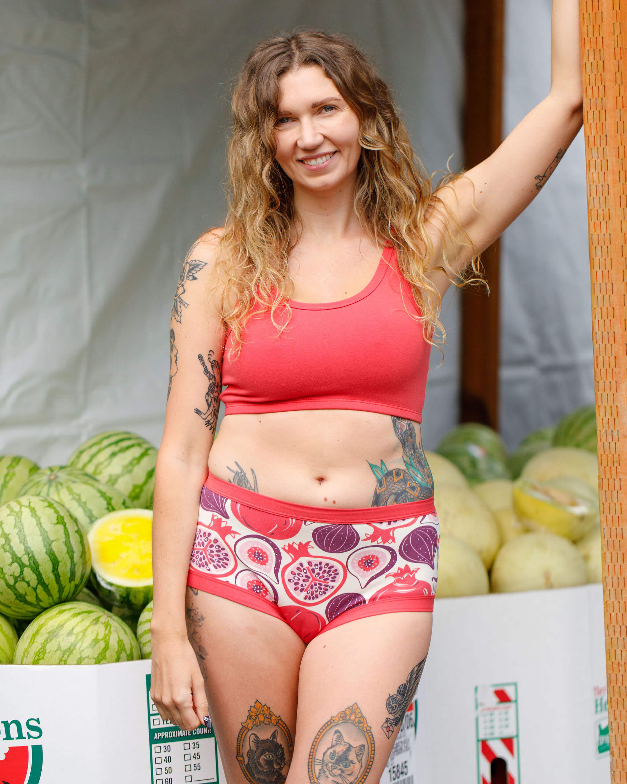 Model wearing Thunderpants Longline Bra in Pomegranate Punch color.