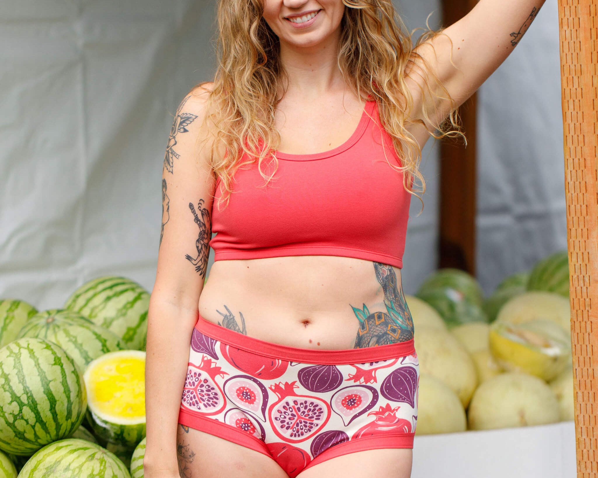 Model wearing Thunderpants Longline Bra in Pomegranate Punch color.