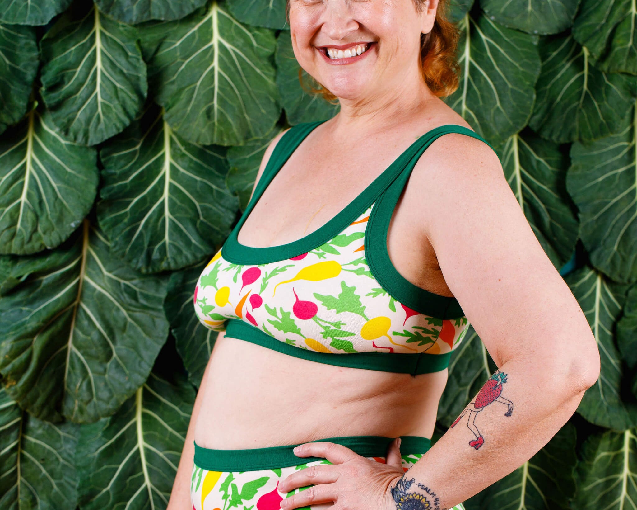 Modeling smiling wearing Thunderpants Bralette and Original style underwear in Root Veggies print.