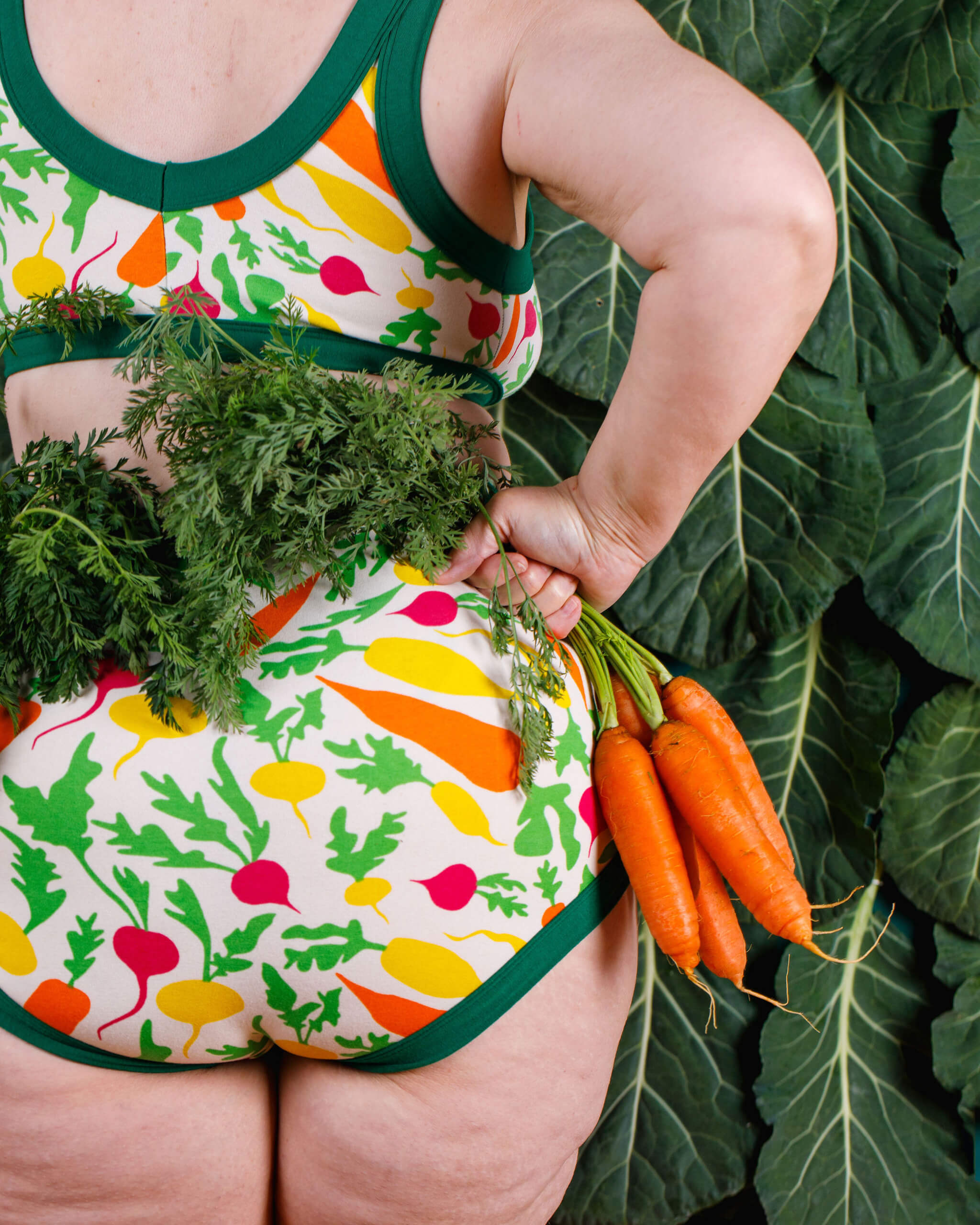 Close up of the back of a model wearing a set of Thunderpants Sky Rise style underwear and Bralette in Root Veggies print.
