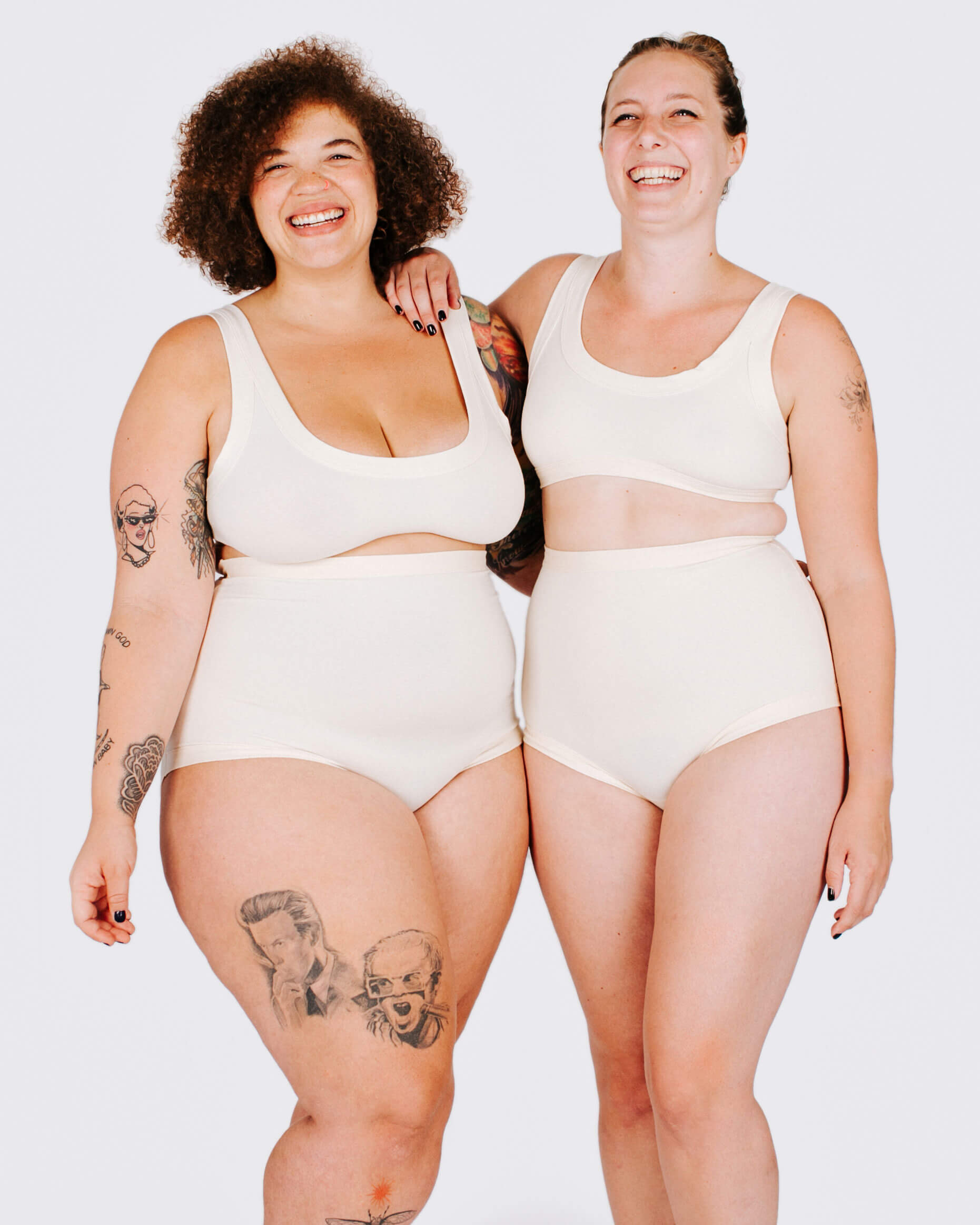 Fit photo from the front of Thunderpants organic cotton Sky Rise style underwear and Bralette in off-white on two models standing together.