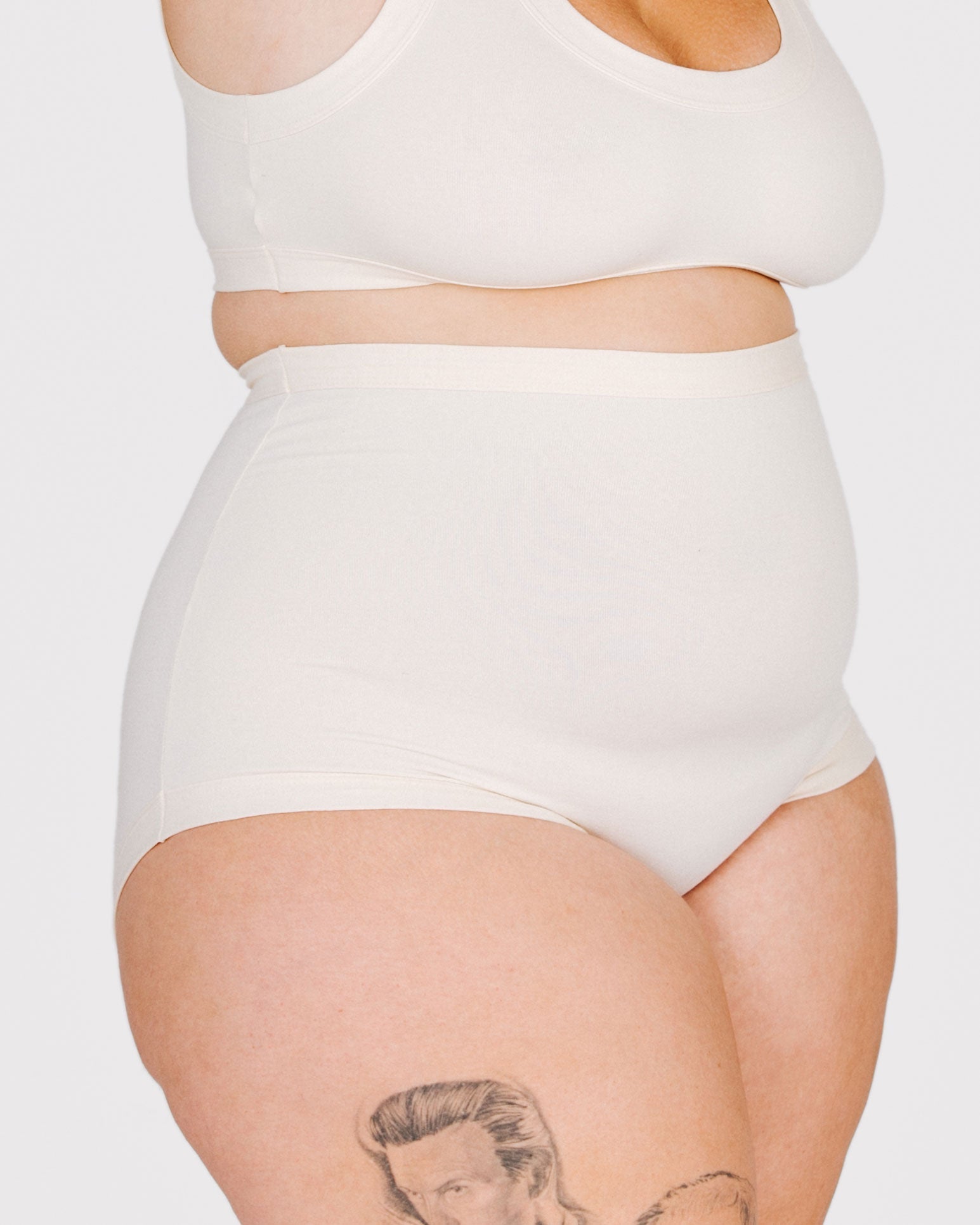 Fit photo from the front of Thunderpants organic cotton Sky Rise style underwear in off-white on a model.