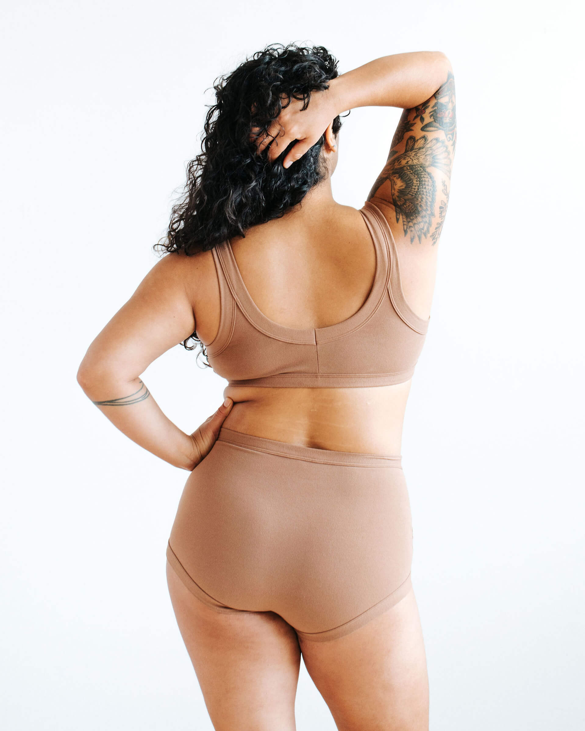 Model wearing Thunderpants Sky Rise style underwear and Bralette in Hazelnut color.