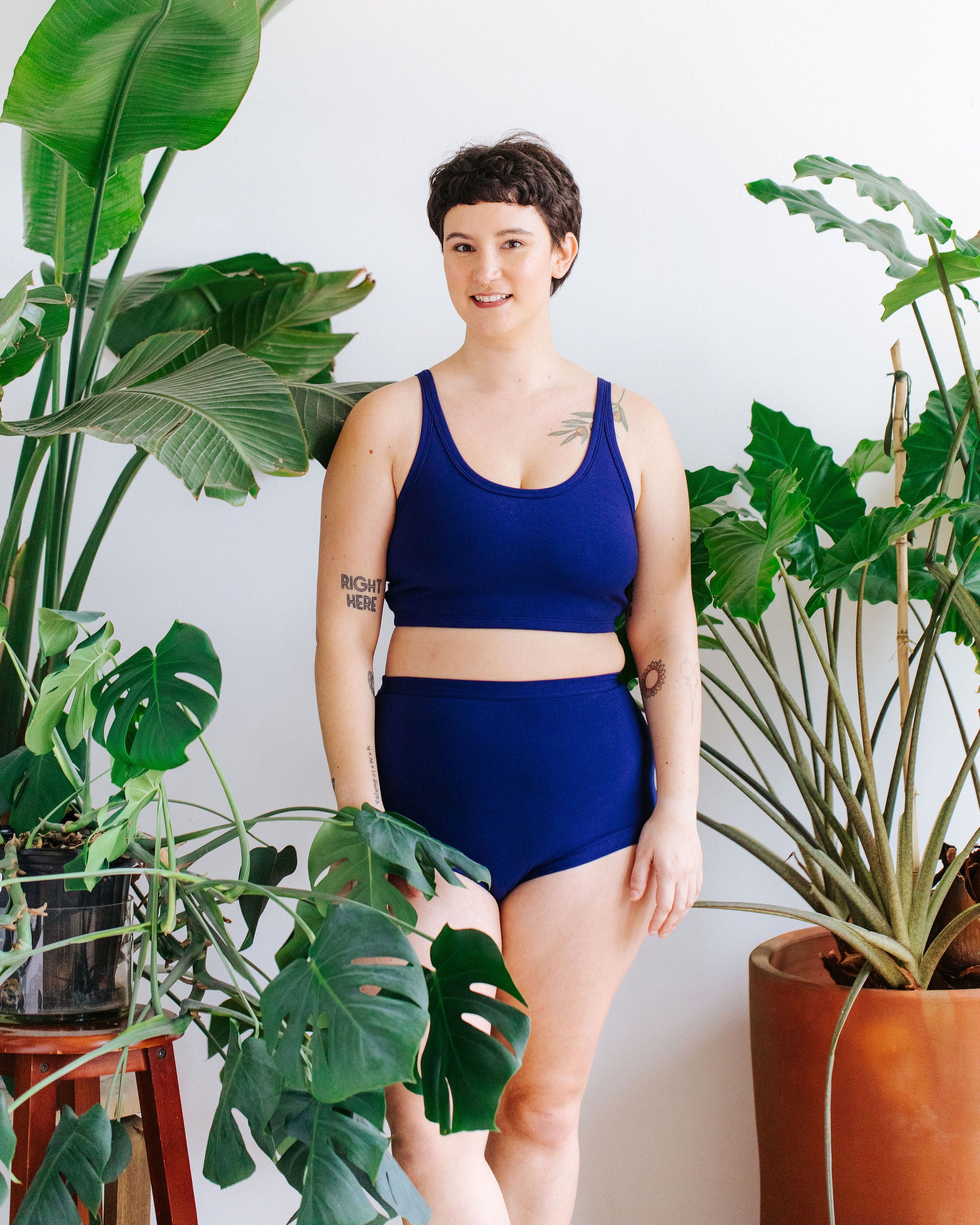 Model wearing Thunderpants Sky Rise style underwear and Longline Bra in Indigo blue.