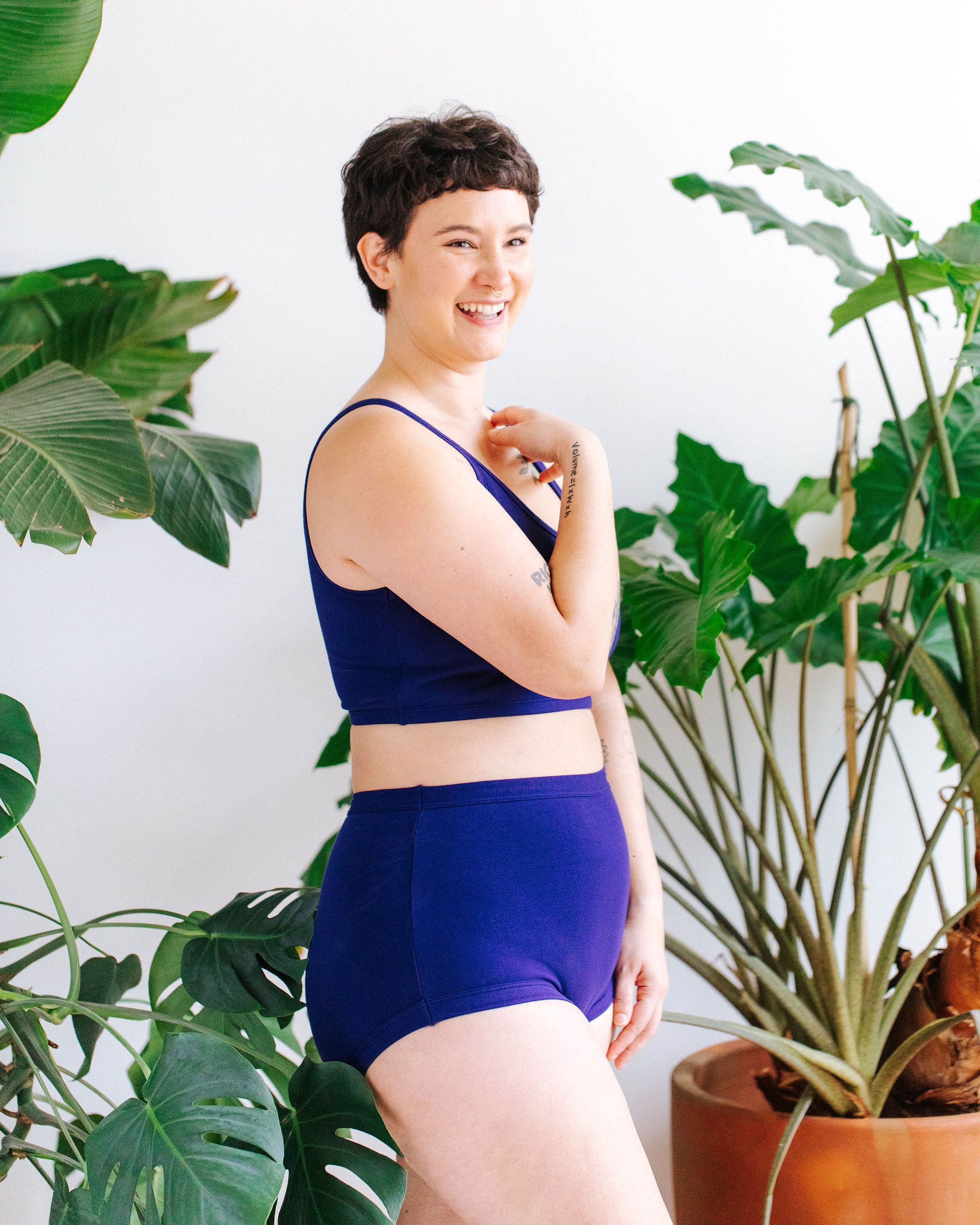 Model wearing Thunderpants Sky Rise style underwear and Longline Bra in Indigo blue.