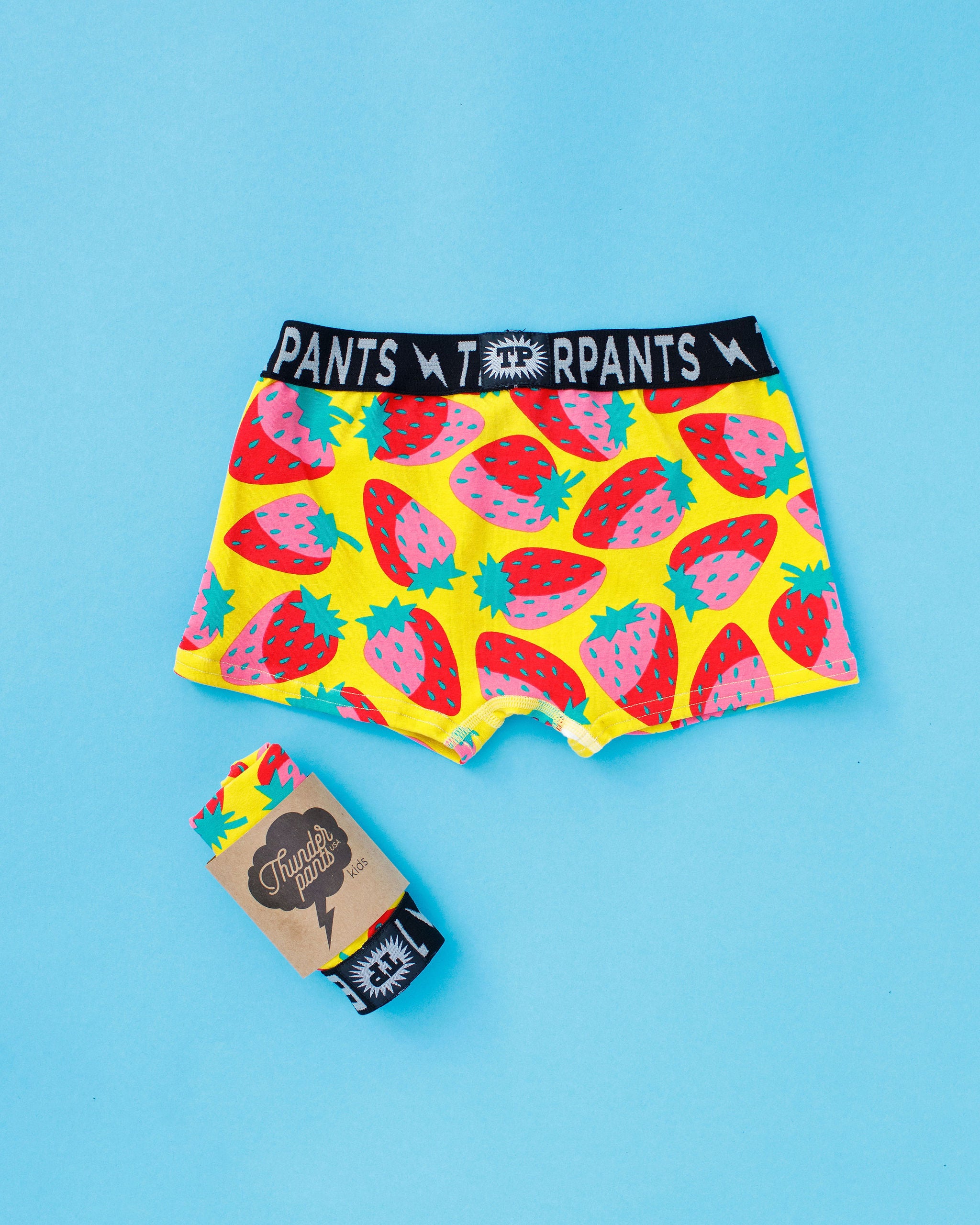 Flat lay of Thunderpants Kid's Boxer Brief style underwear in Strictly Strawberry print.