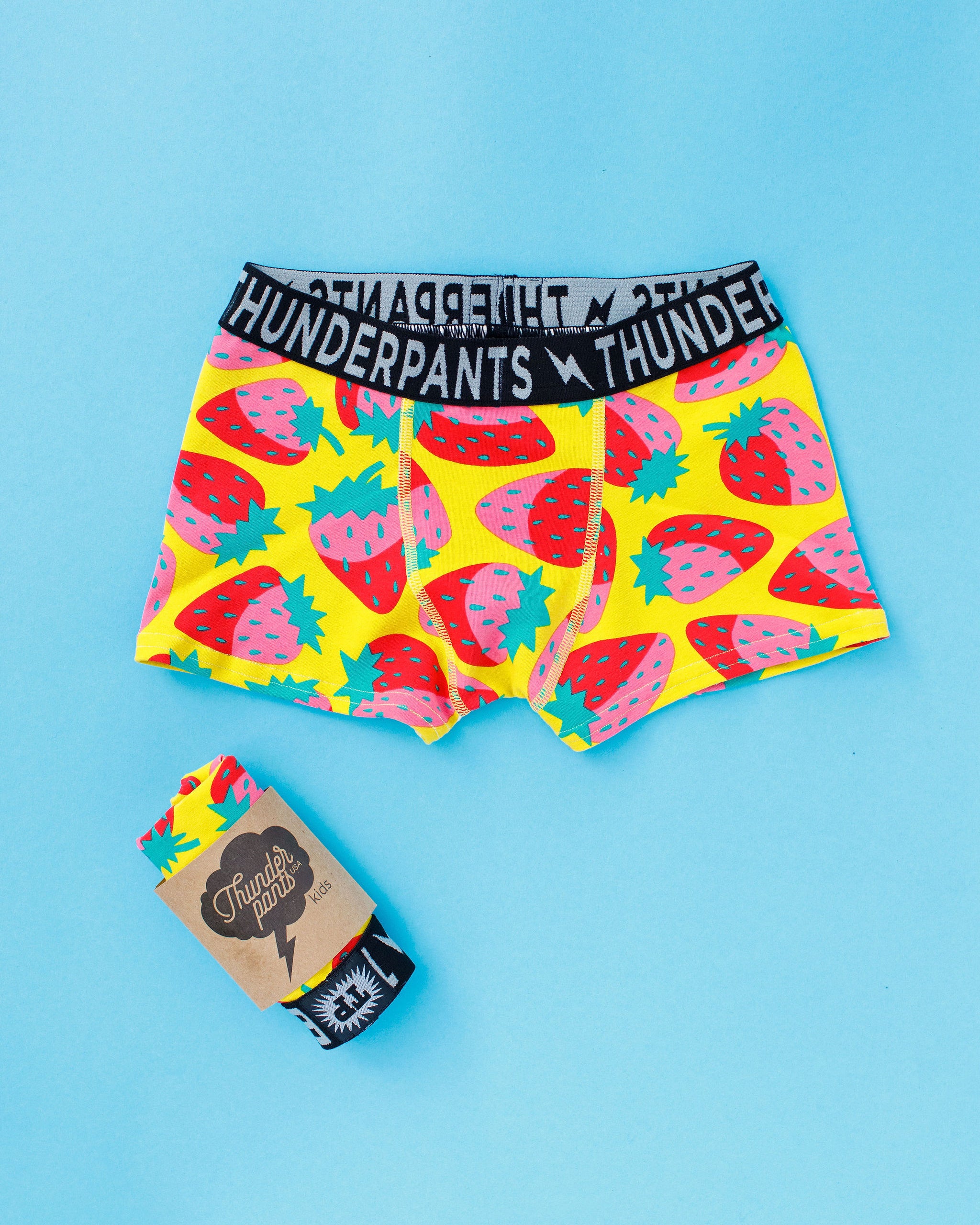 Flat lay of Thunderpants Kid's Boxer Brief style underwear in Strictly Strawberry print.