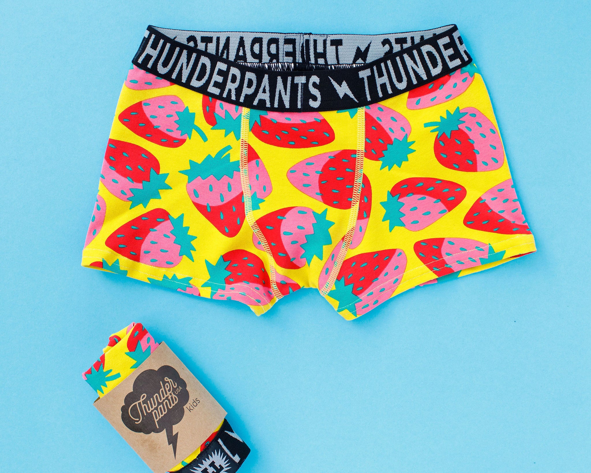 Flat lay of Thunderpants Kid's Boxer Brief style underwear in Strictly Strawberry print.