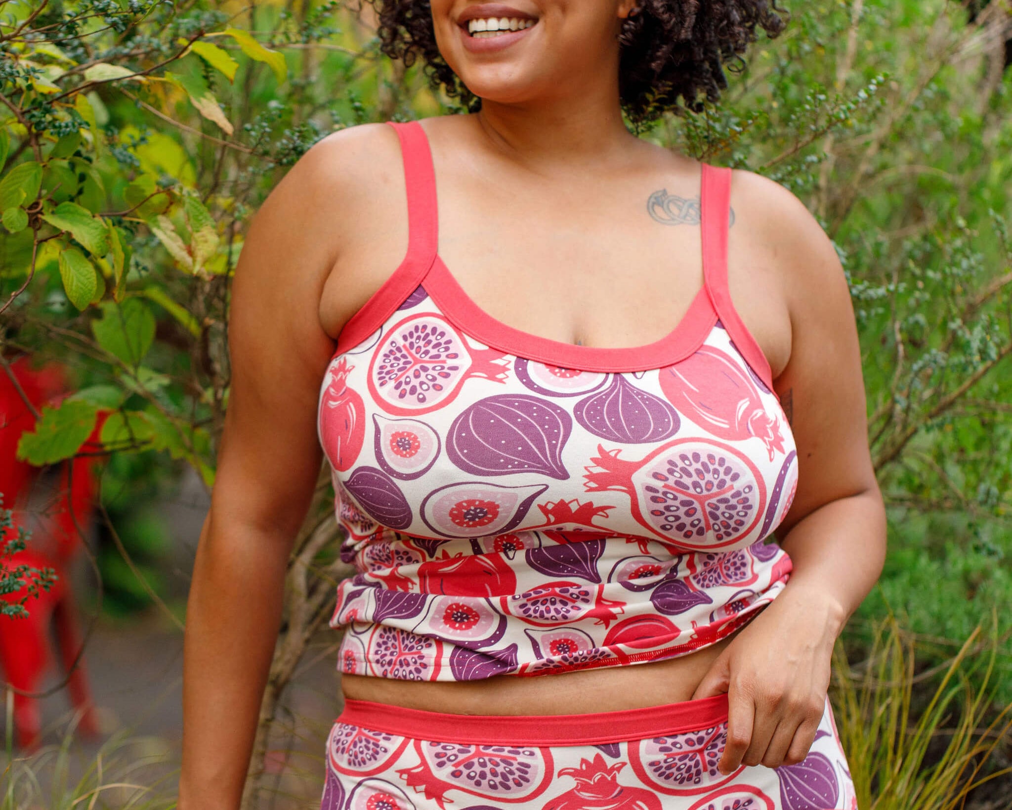 Model wearing Thunderpants Camisole and Hipster style underwear in Two Fruits - pomegranates and figs.