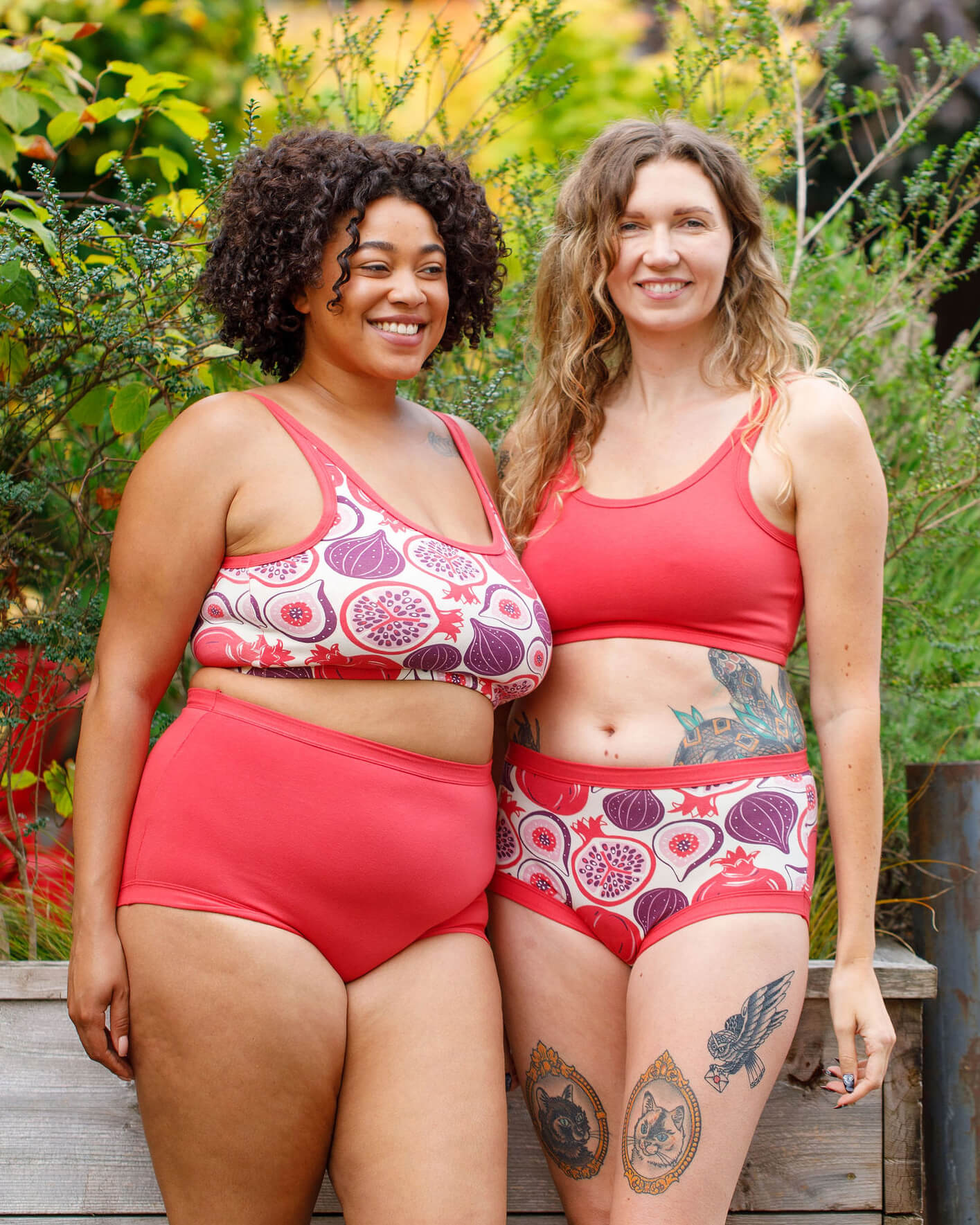 Two models wearing various Thunderpants items in Two Fruits and Pomegranate Punch.