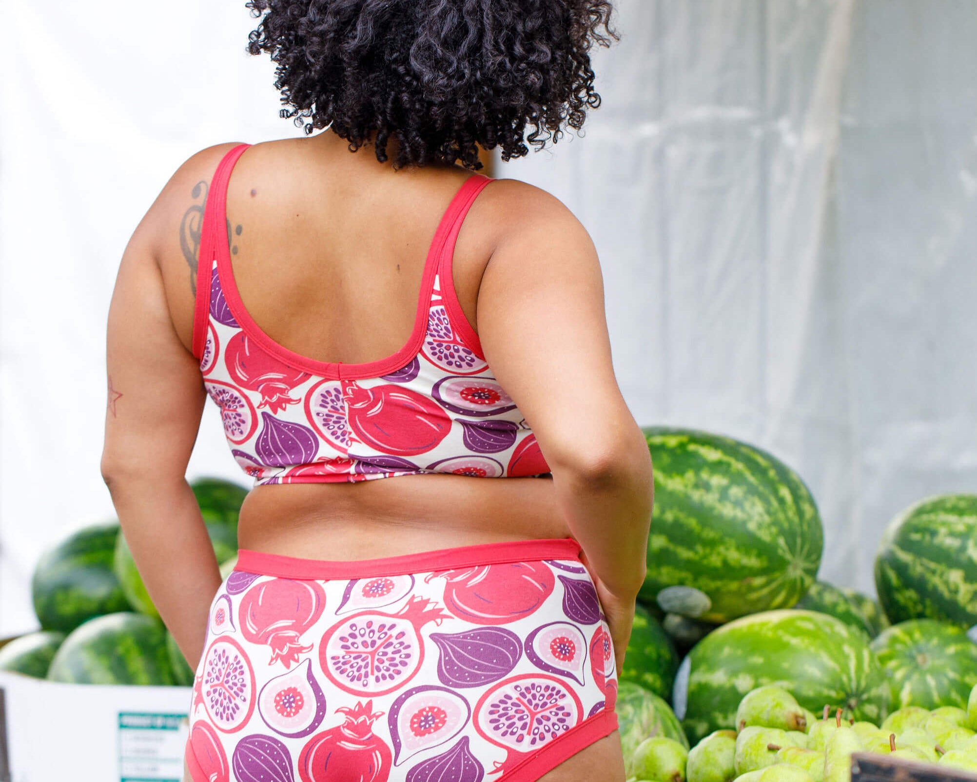 Model wearing Thunderpants Original style underwear and Longline Bra in Two Fruits - pomegranates and figs.