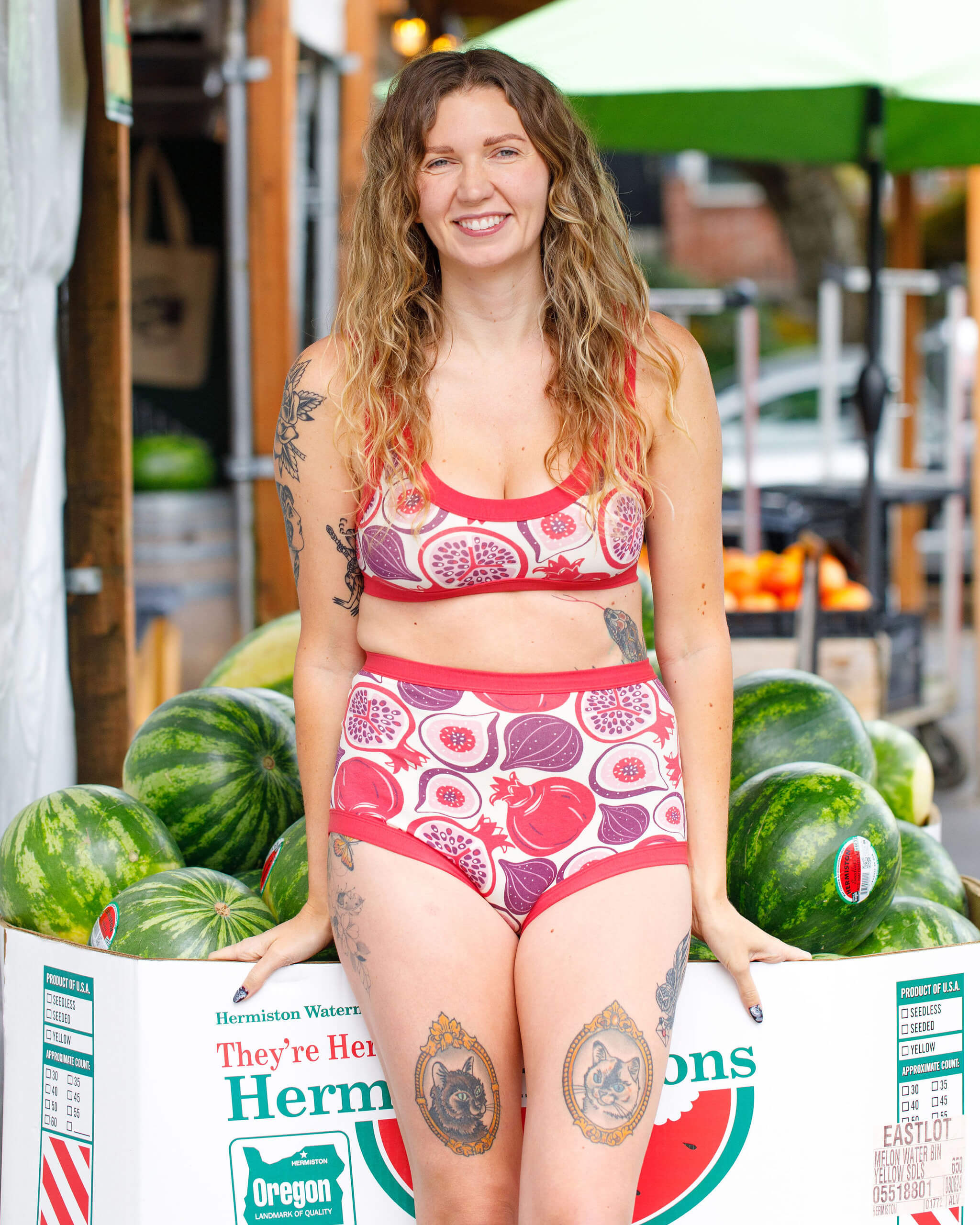 Model wearing Thunderpants Sky Rise style underwear and Bralette in Two Fruits - pomegranates and figs.