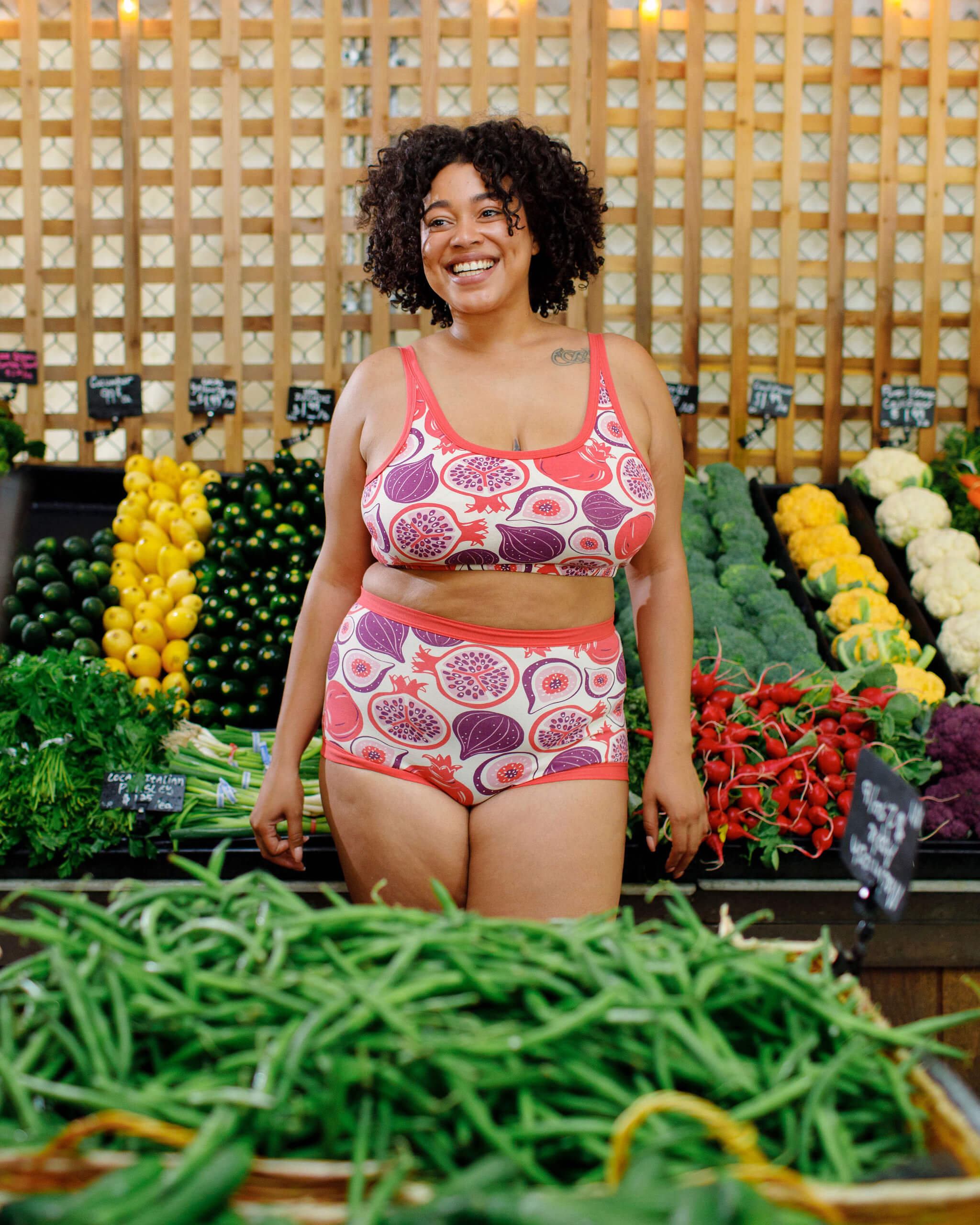 Model wearing Thunderpants Sky Rise style underwear and Longline Bra in Two Fruits - pomegranates and figs.