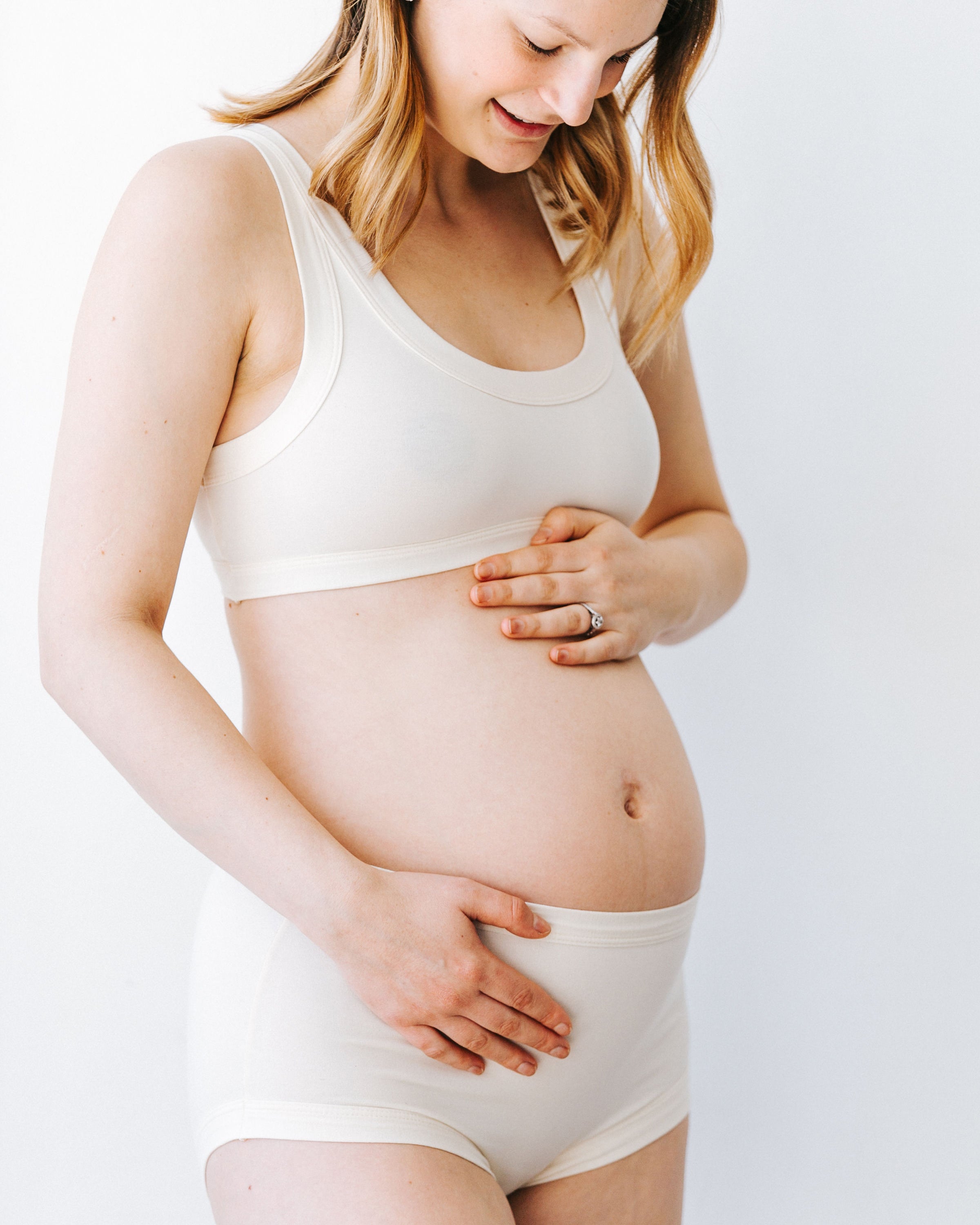 Pregnant model wearing Thunderpants Original style underwear and Bralette in Plain Vanilla.