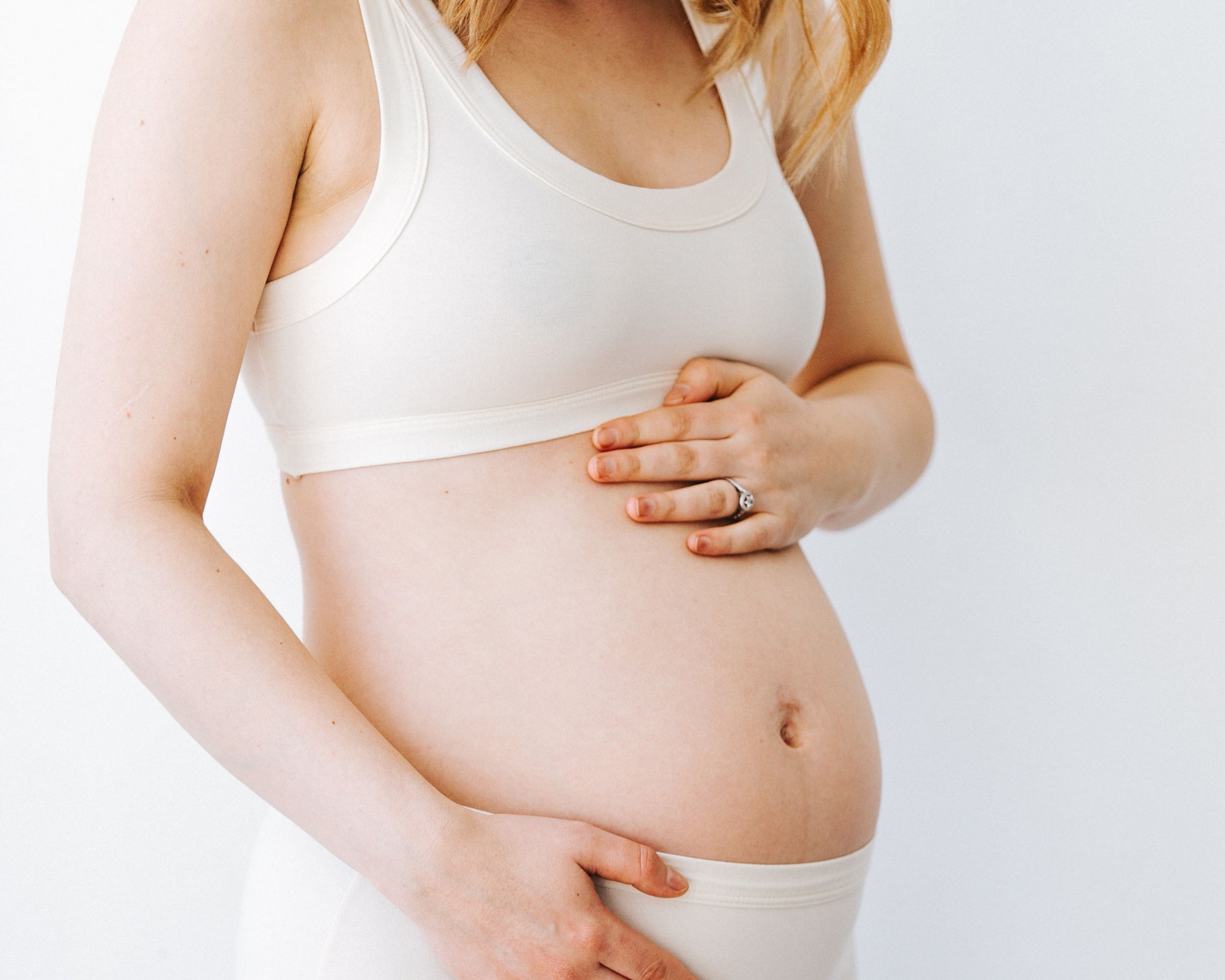 Pregnant model wearing Thunderpants Original style underwear and Bralette in Plain Vanilla.