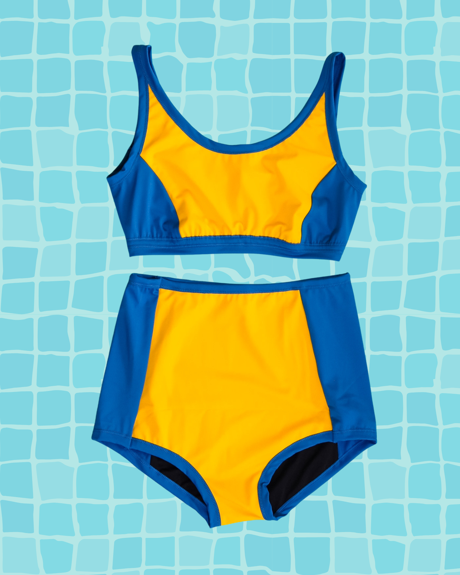 Flat lay of Thunderpants US yellow and blue paneled Swimwear Top and Sky Rise style bottoms. 