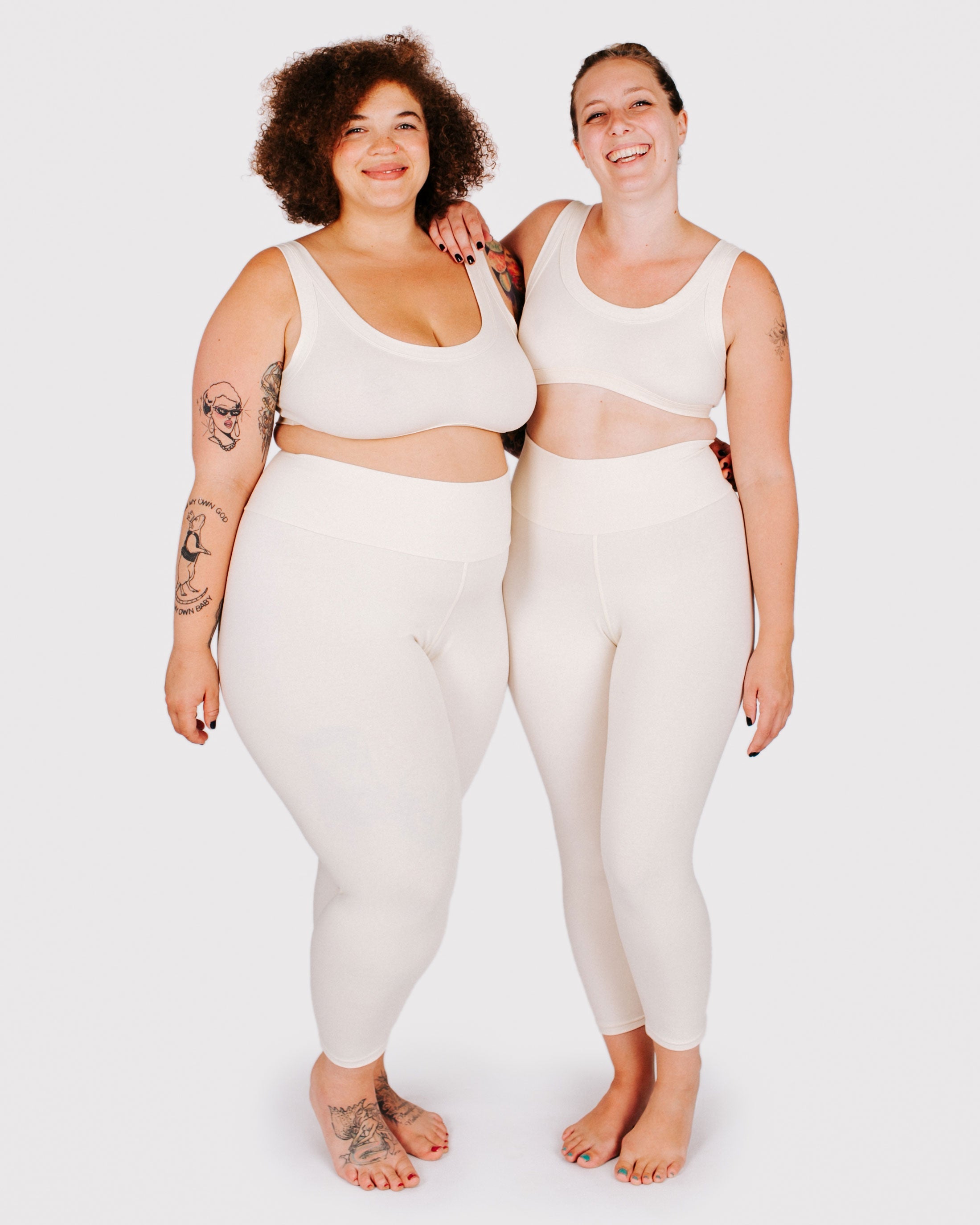 Fit photo from the front of Thunderpants organic cotton 3/4 Length Leggings and Bralettes in off-white on two models standing together.