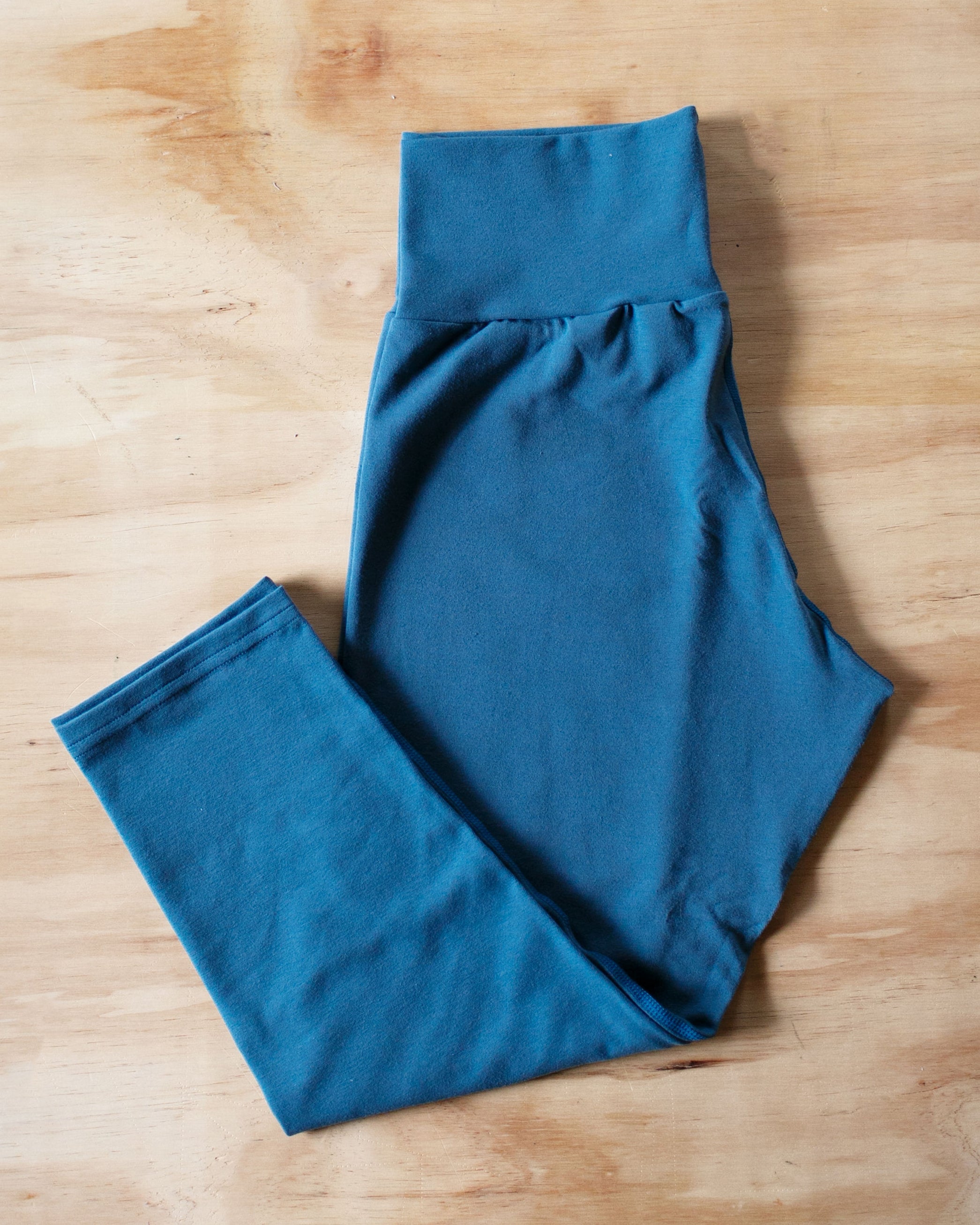 Flat lay of Thunderpants Organic Cotton 3/4 Length Leggings in Stormy Blue color.