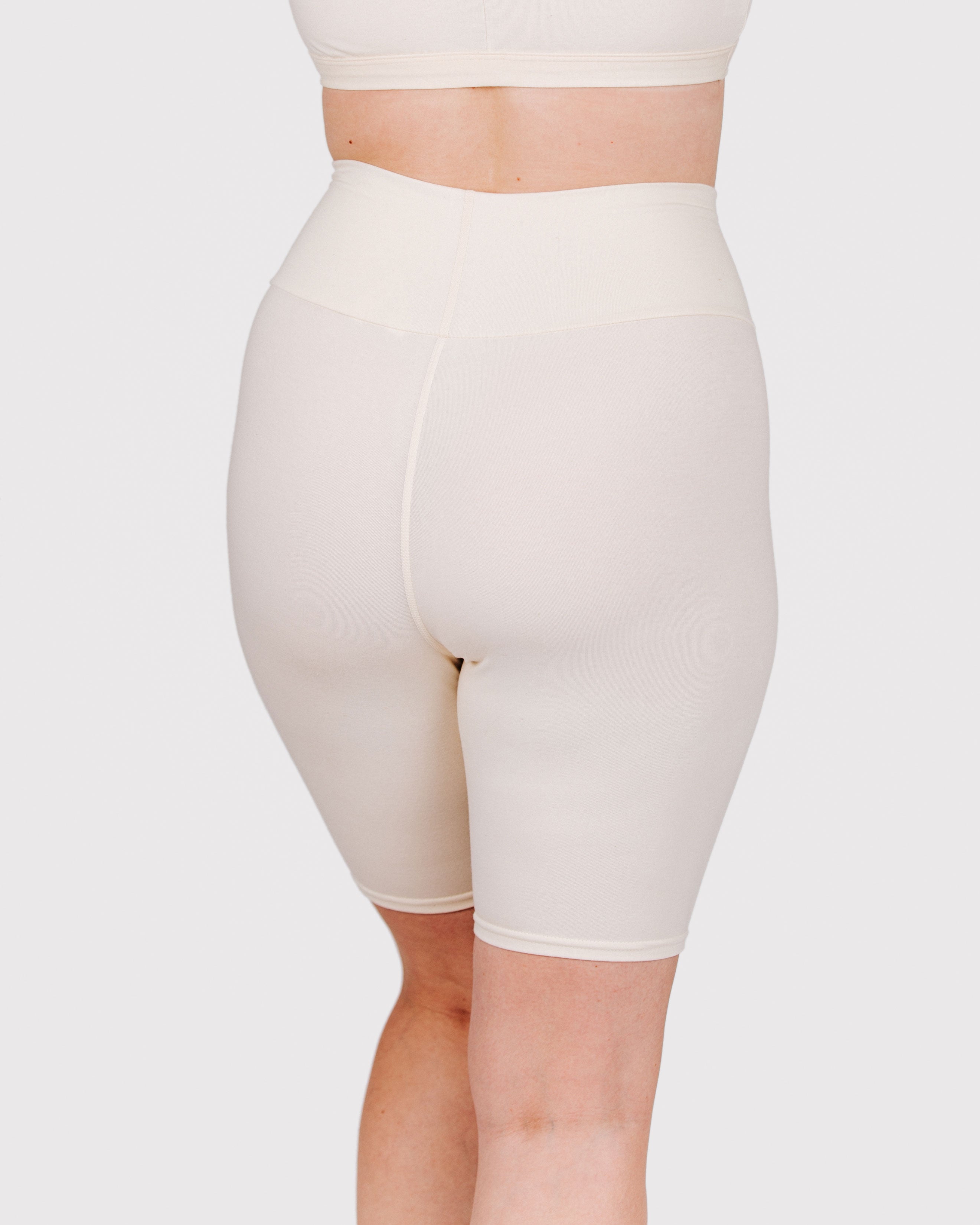 Fit photo from the back of Thunderpants organic cotton Bike Shorts in off-white on a model.