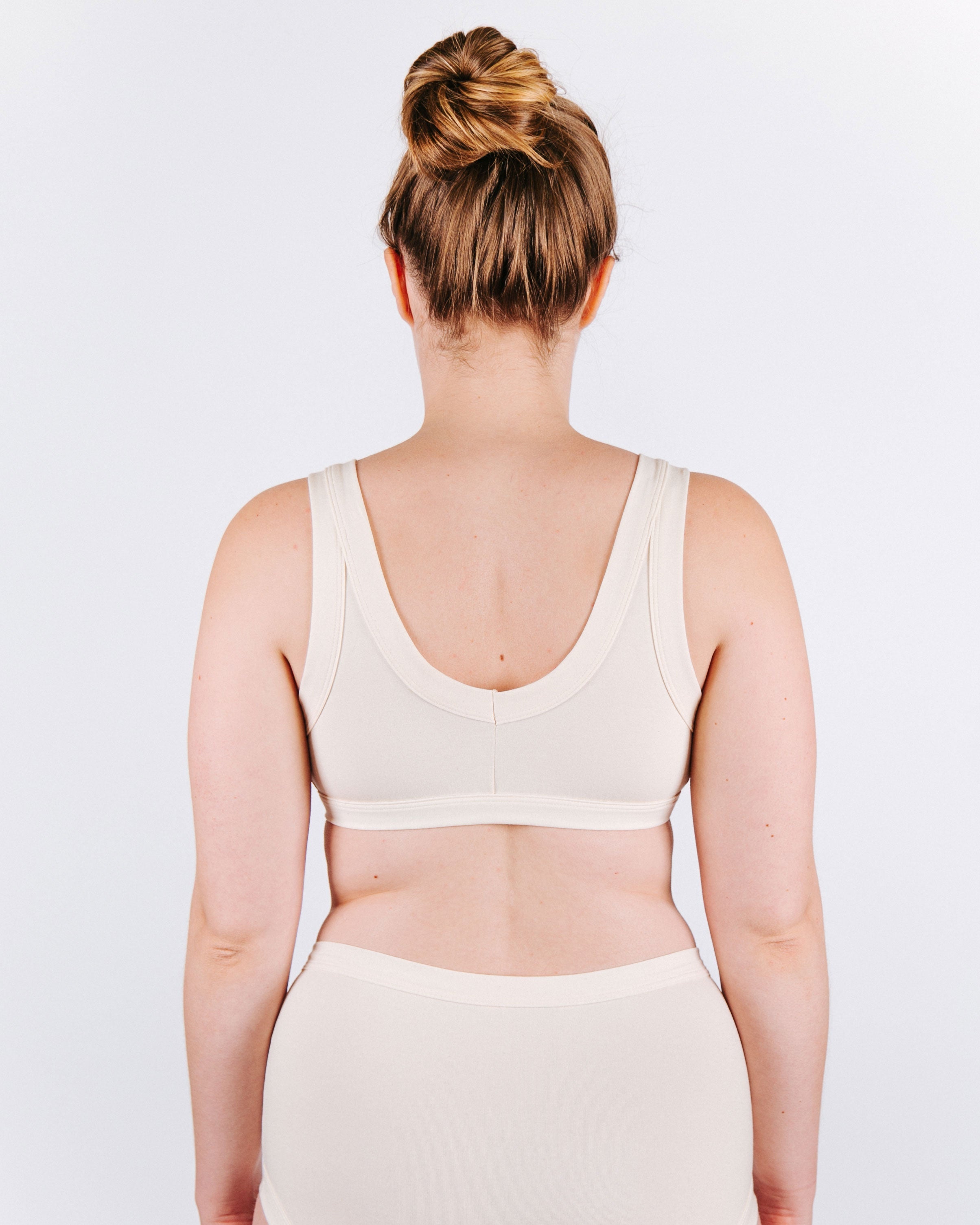 Fit photo from the back of Thunderpants organic cotton Bralette and Original Style underwear in off-white on a model.