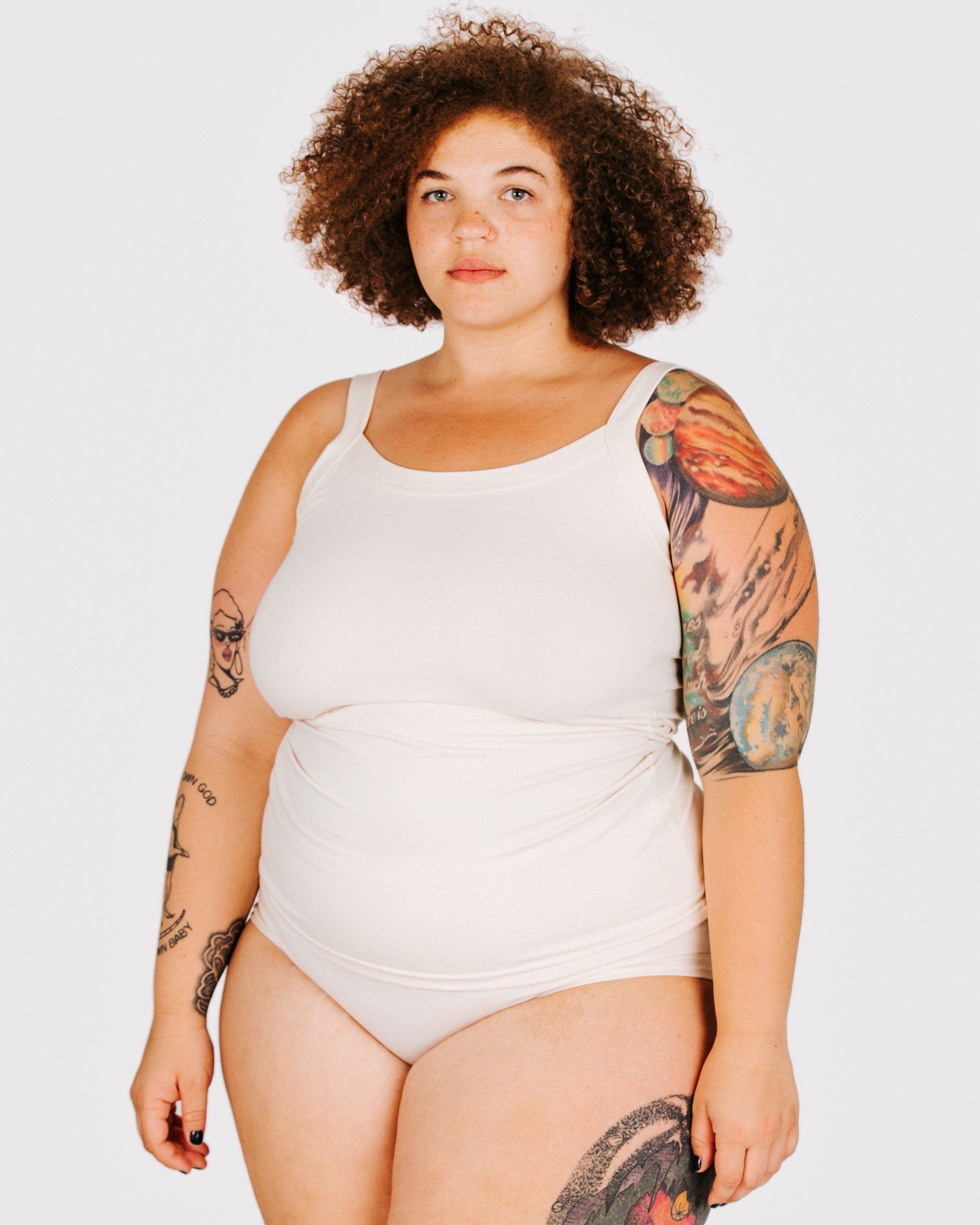 Fit photo from the front of Thunderpants organic cotton Camisole and Hipsters style underwear in off-white on a model.