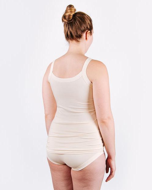 Fit photo from the back of Thunderpants organic cotton Camisole and Women’s Hipster style underwear in off-white, showing a wedge-free bum, on a woman.