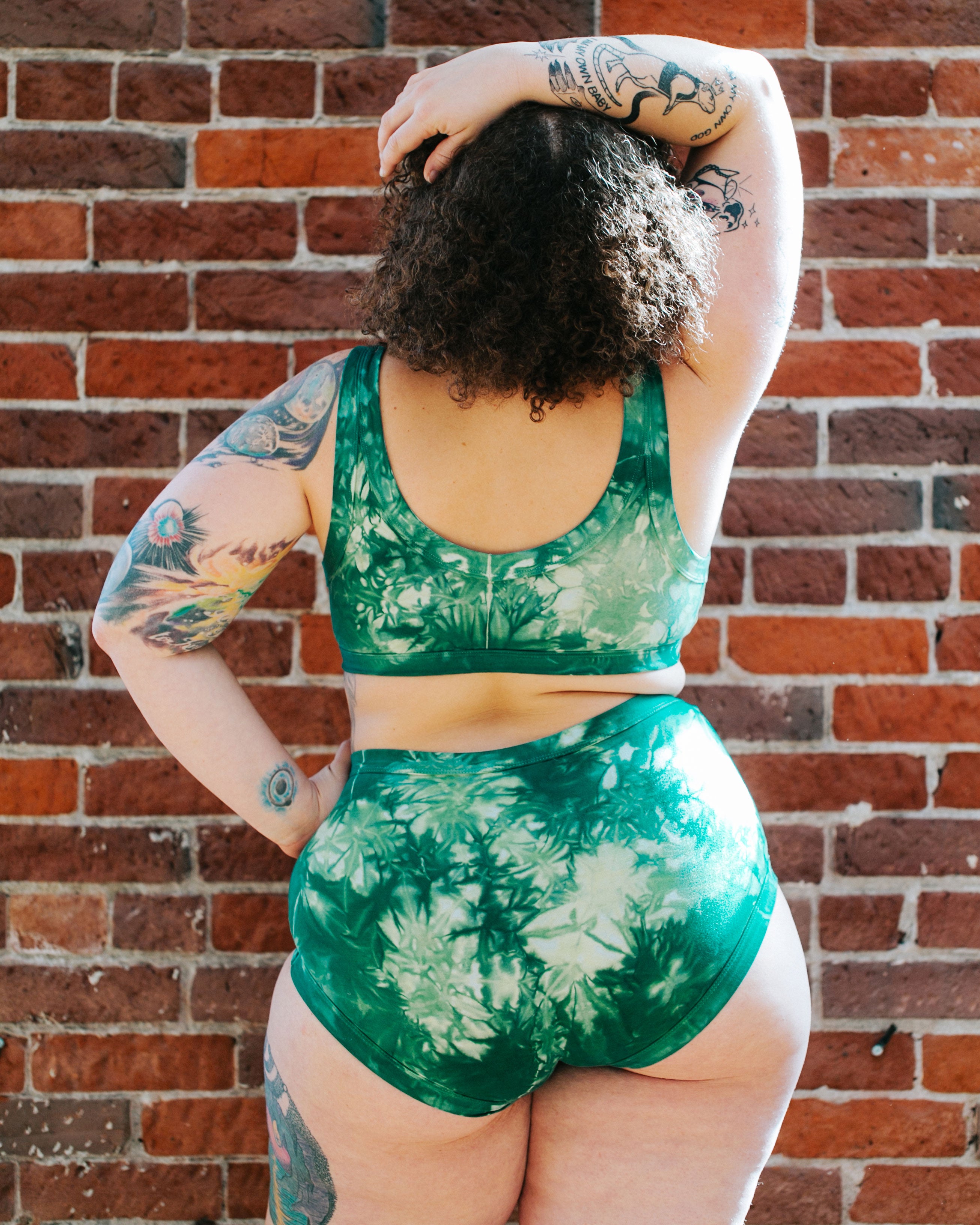 Model's bum wearing Thunderpants organic cotton Bralette and Sky Rise in Clover Green scrunch dye.