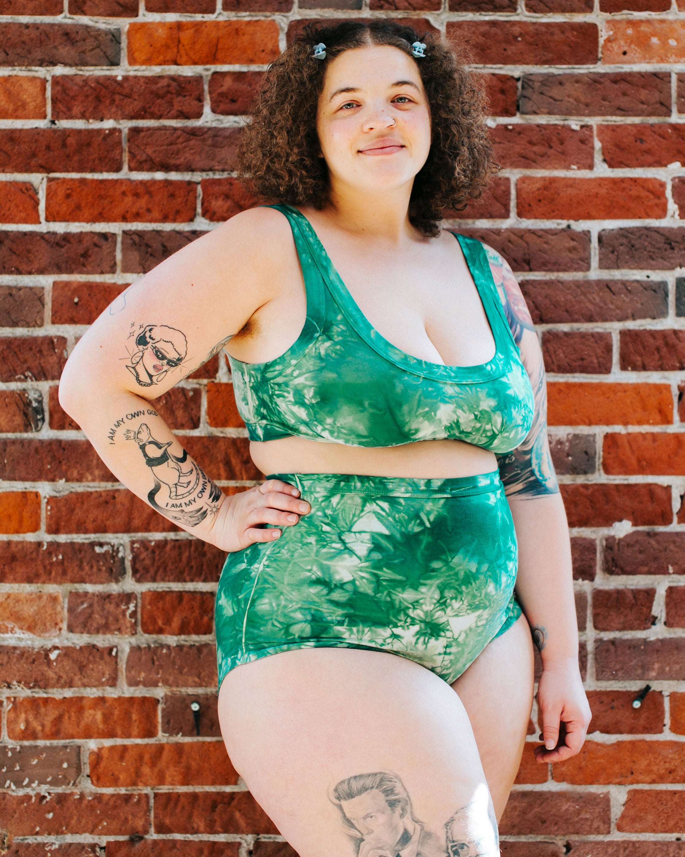 Model wearing Thunderpants organic cotton Sky Rise style underwear and Bralette in Clover Green scrunch dye.