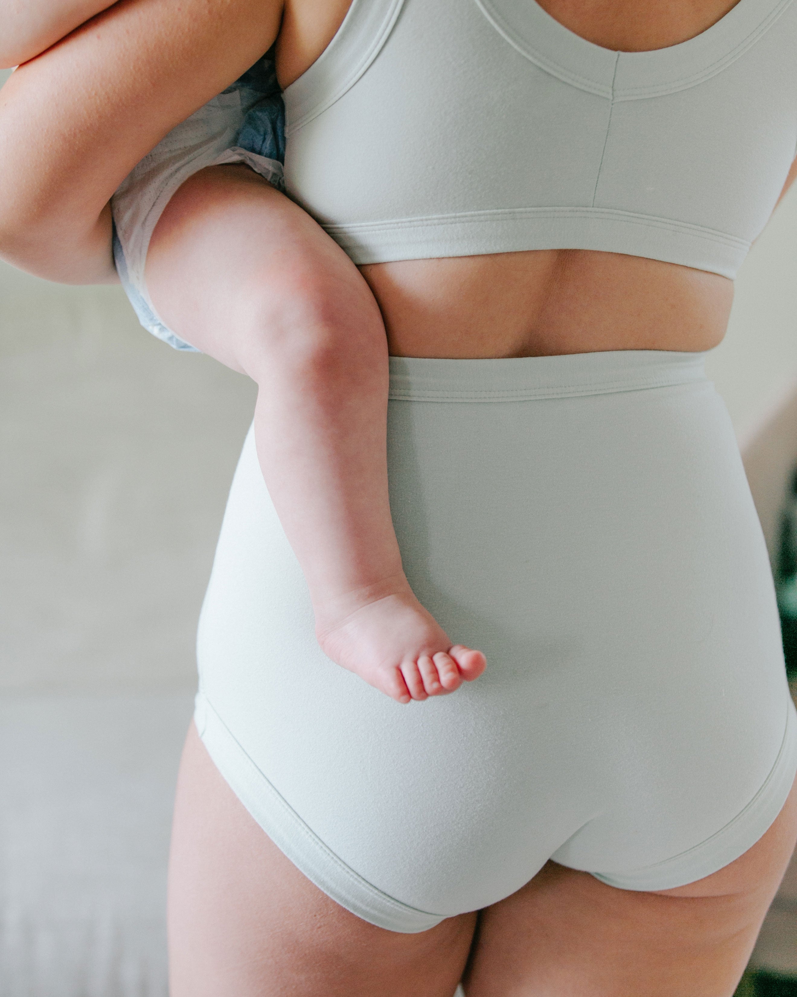 Back of a model, showing her bum wearing Sky Rise style underwear and Bralette in Dried Sage color.