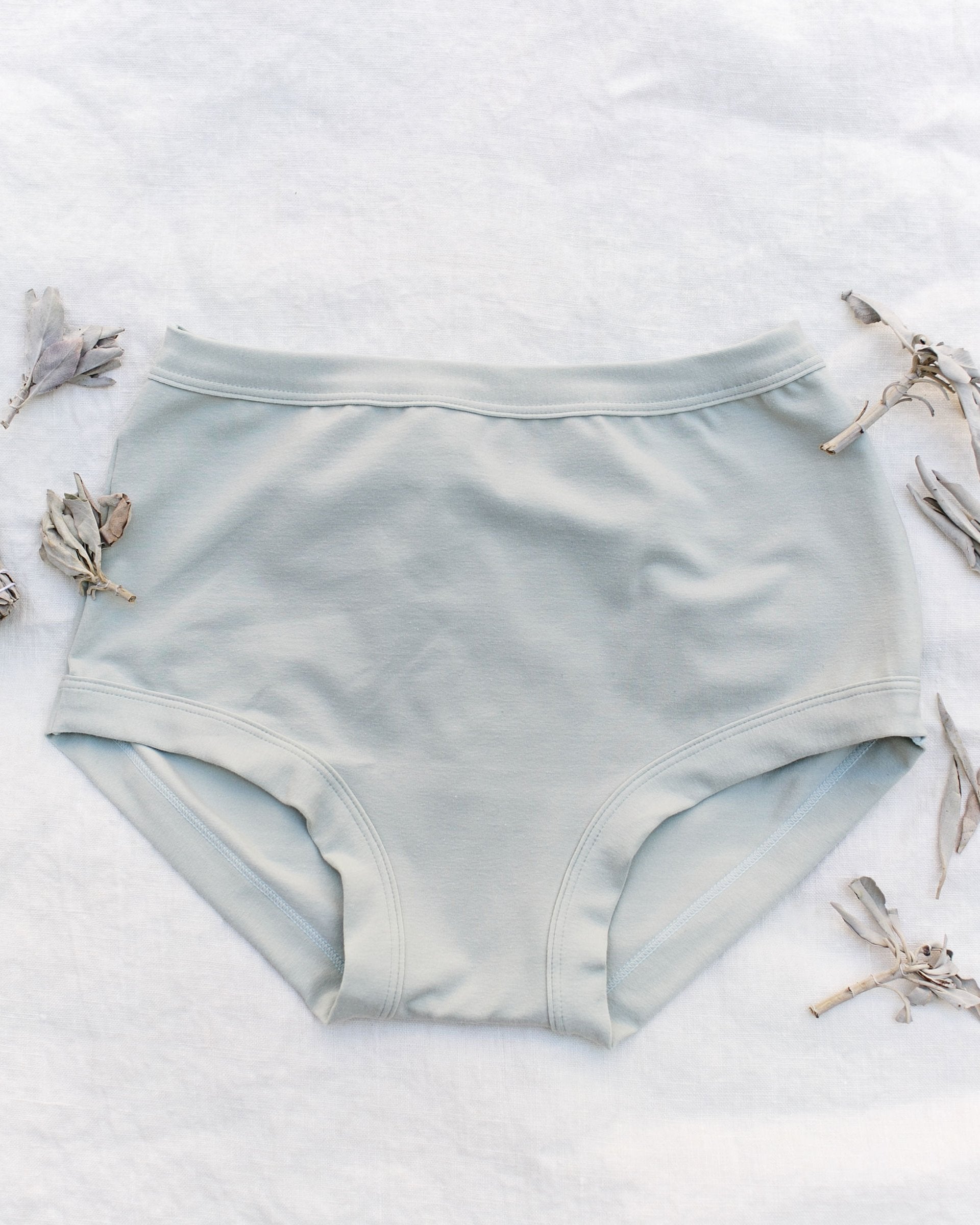 Flat lay of Thunderpants organic cotton Original style underwear in plain dried sage.