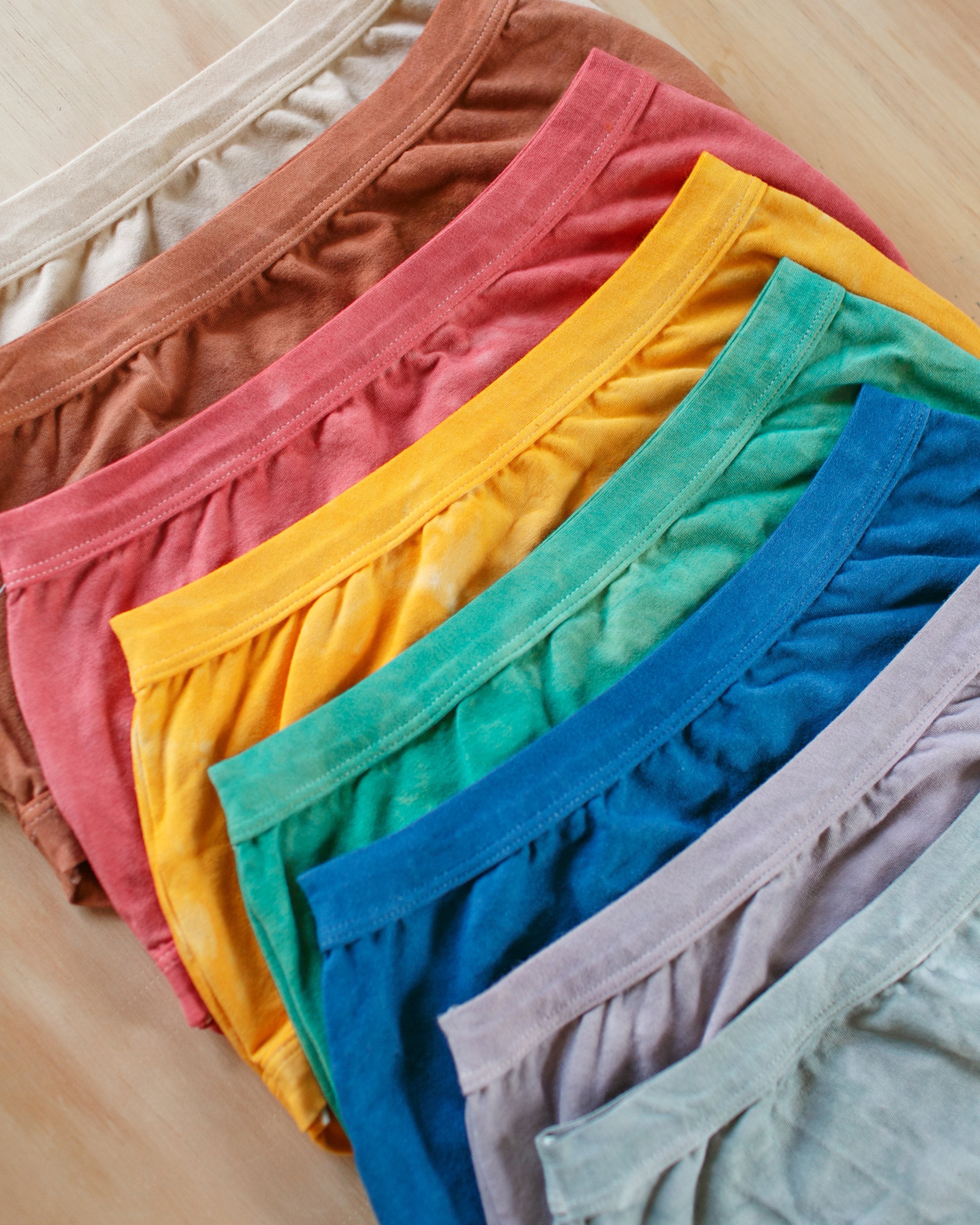 Eight Thunderpants organic cotton underwear in different limited edition hand dyed colors.