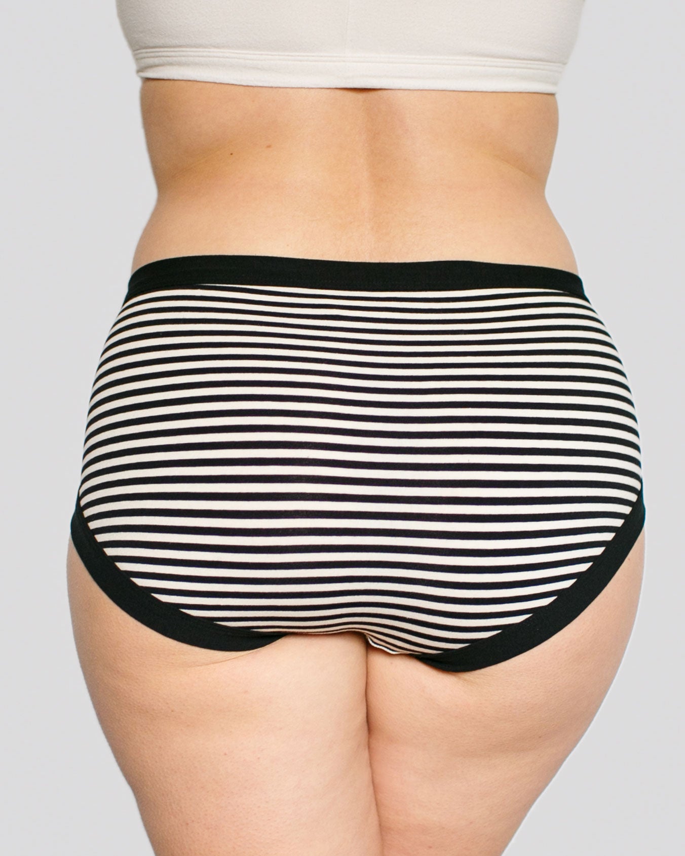 Model's bum wearing Thunderpants organic cotton Hipster style underwear in Black and White Stripes.