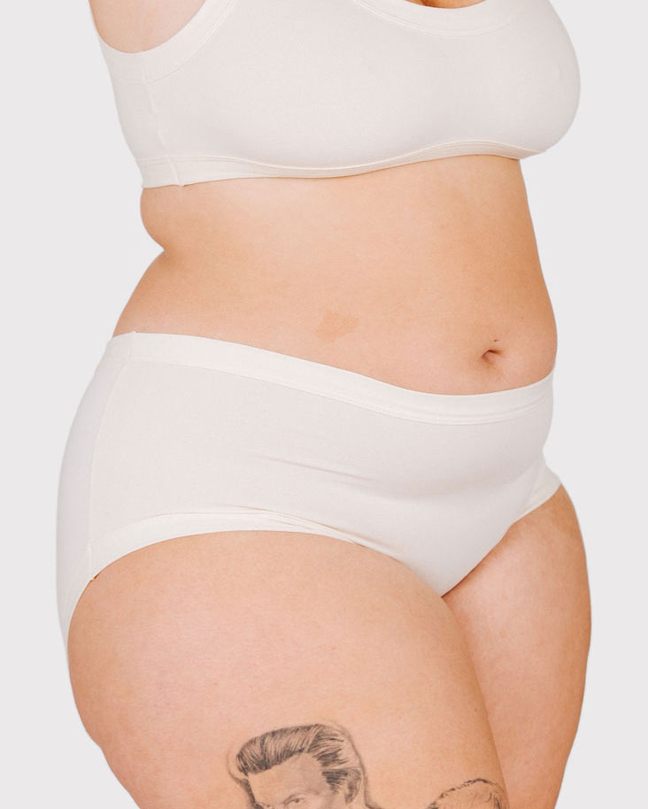 Fit photo from the front of Thunderpants organic cotton Hipster style underwear in off-white vanilla on a model.