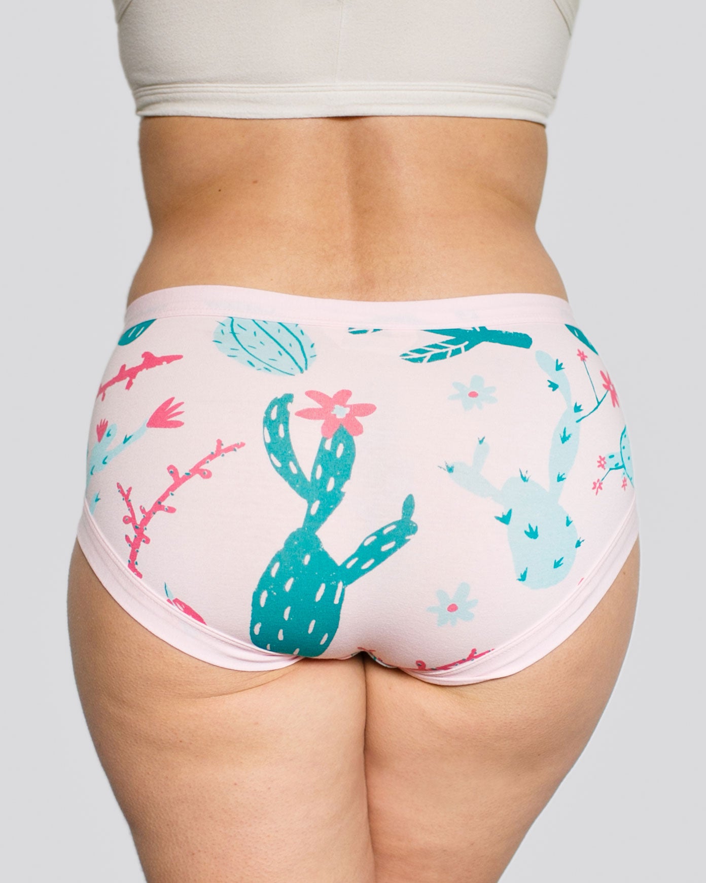 Models bum wearing Thunderpants organic cotton Hipster style underwear in Prickly Cactus print: Perfect Pink with green and pink cacti.