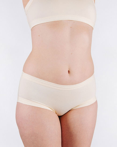 Fit photo from the front of Thunderpants organic cotton Hipster style underwear in off-white vanilla on a model.
