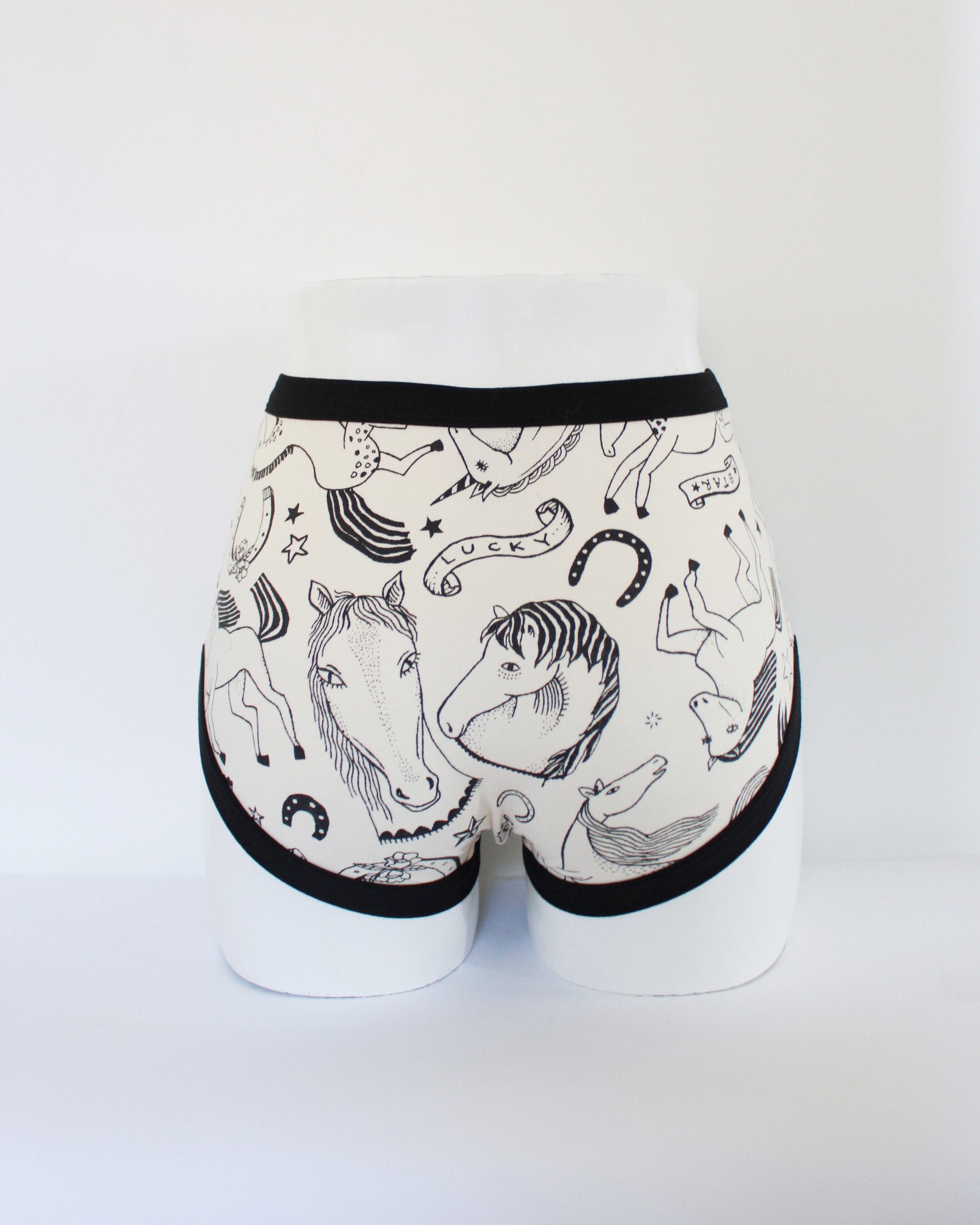 Back of Thunderpants organic cotton Original Panel Pant style underwear in a black and white horses print shown on mannequin bum and legs.