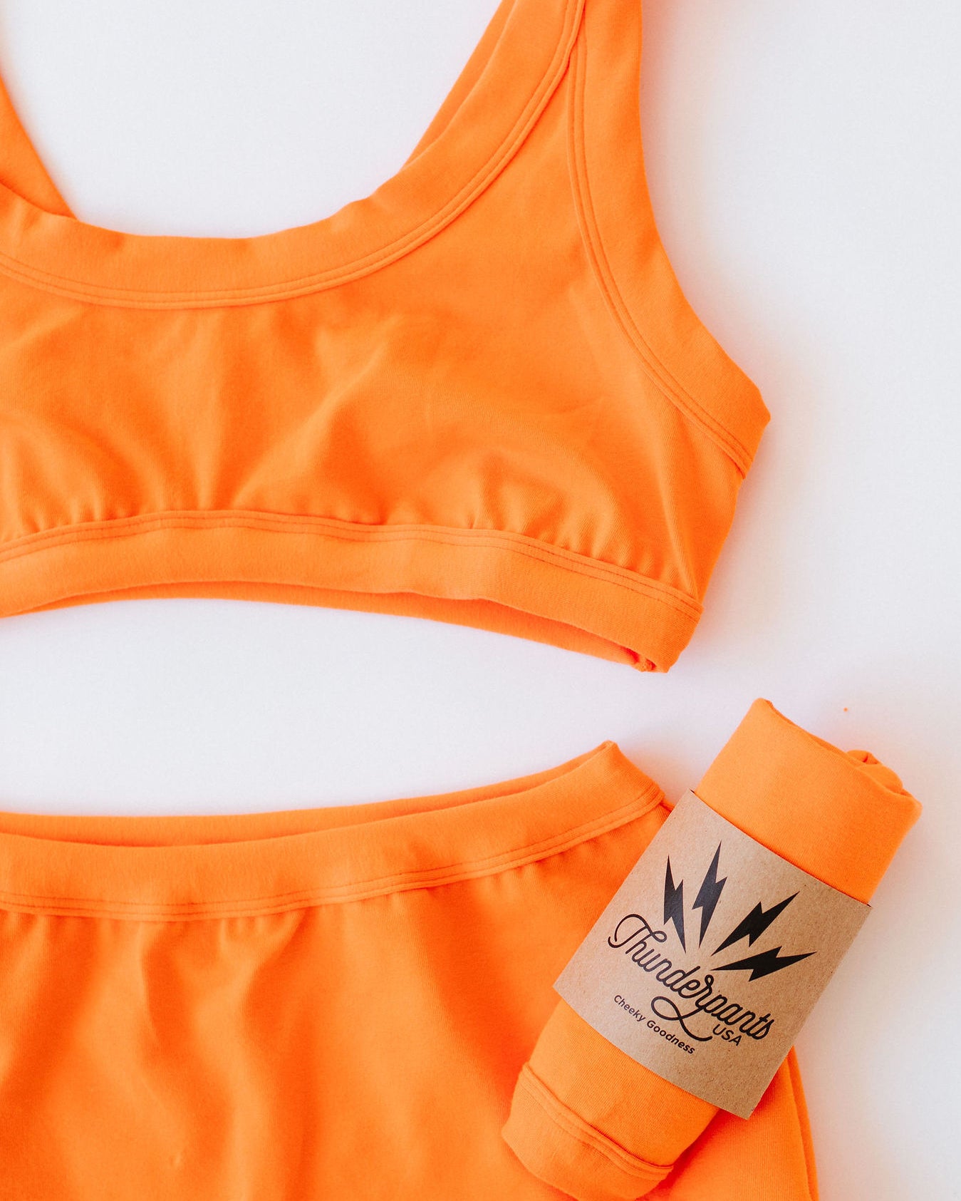 Close up of Thunderpants Sky Rise style underwear and Bralette in Oregon Sunstone orange color.