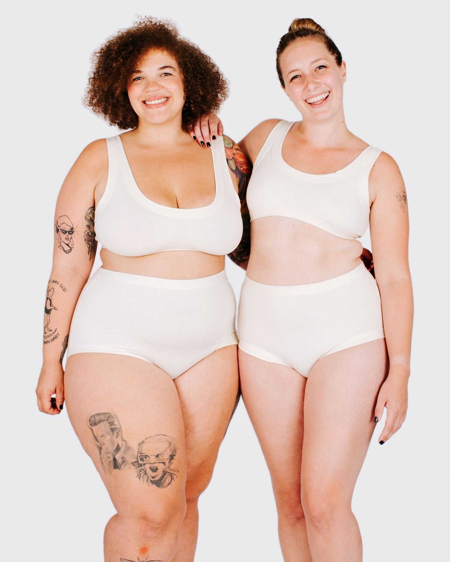 Fit photo from the front of Thunderpants organic cotton Original style underwear and Bralette in off-white on two model standing together.