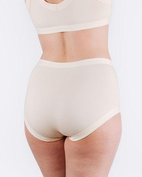 Fit photo from the back of Thunderpants organic cotton Women’s Original style underwear in off-white on, showing a wedgie-free bum, on a woman.
