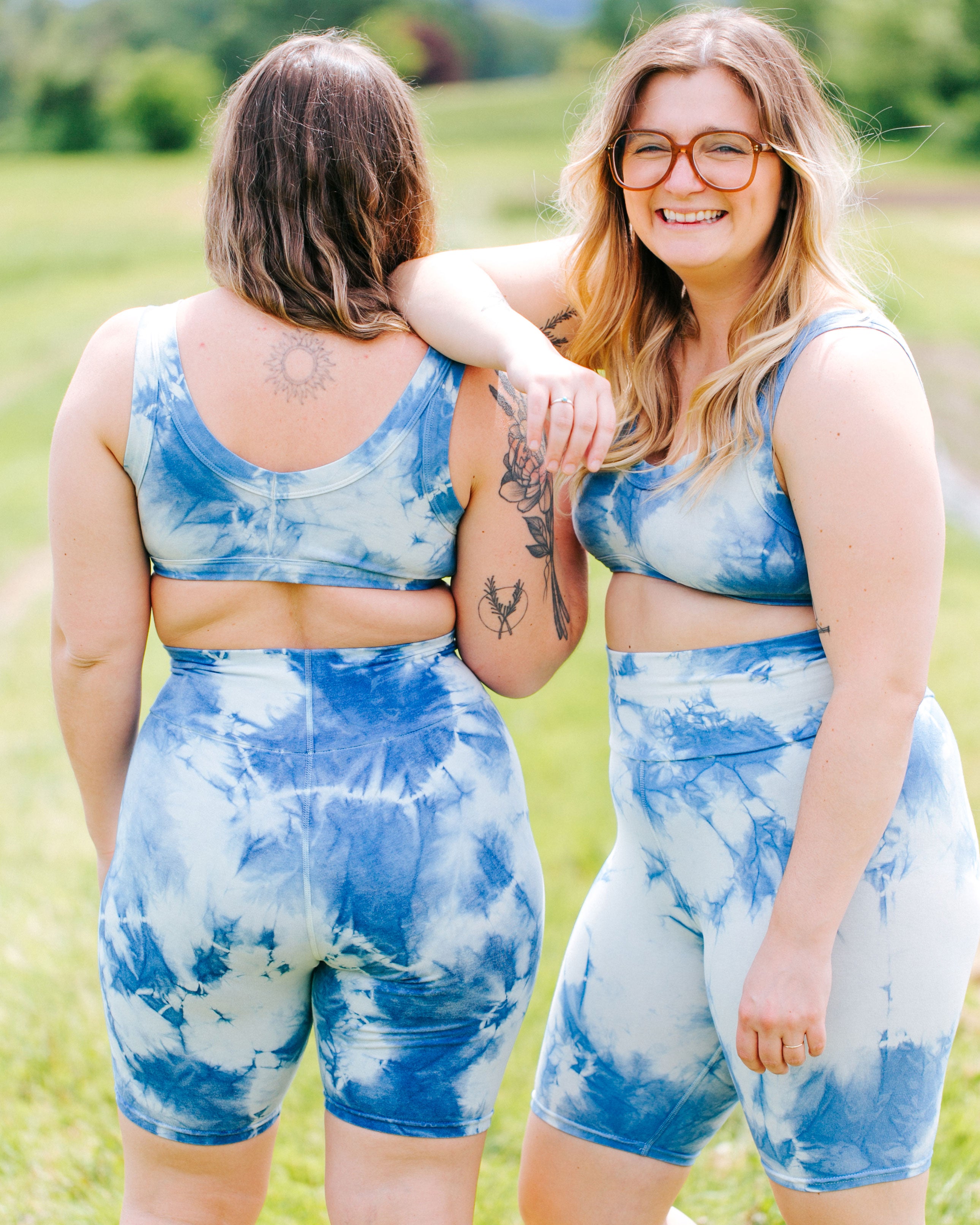 Two models wearing indigo dyed Sauvie Skies Bralettes and Bike Shorts.